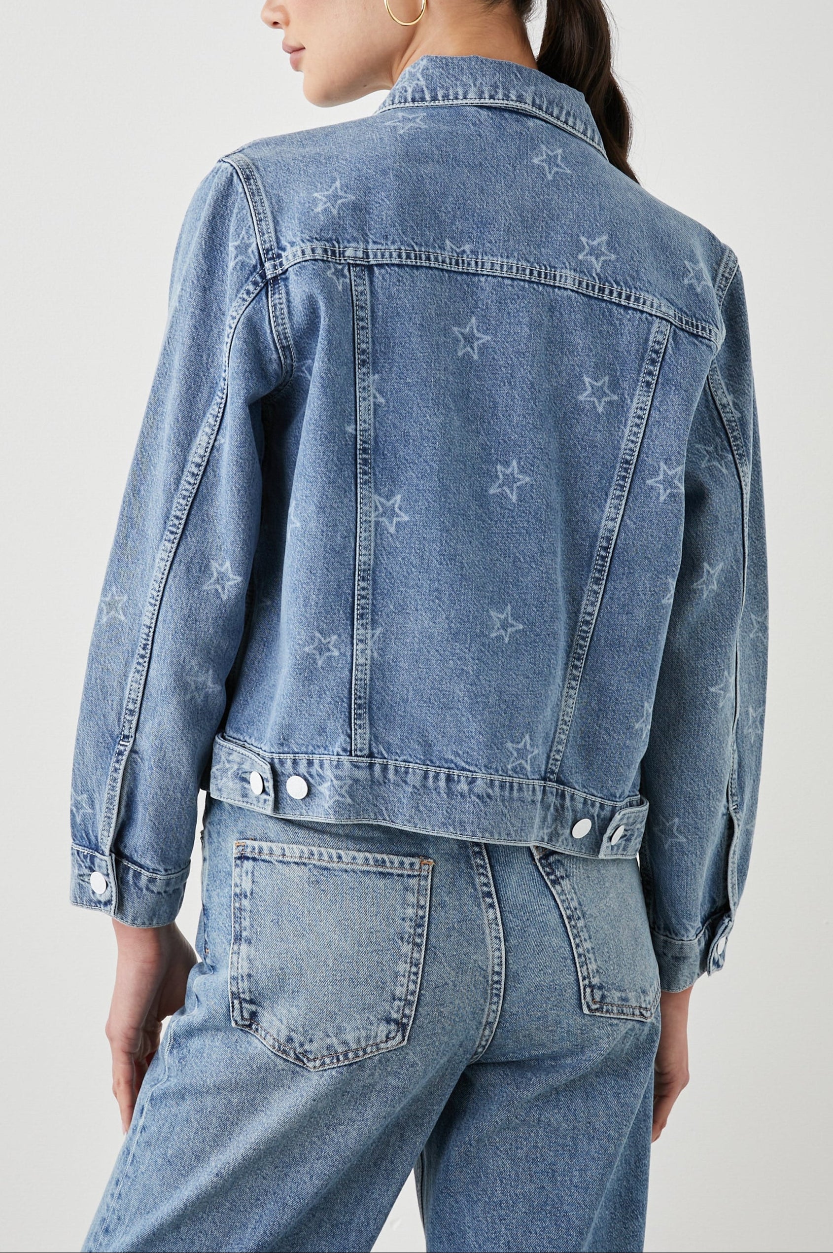 Mulholland Denim Jacket with Button Closure, Two Chest Button Flap Pockets, Two Front Pockets, Adjustable Button Straps on Hem in Lady Liberty Colorway, with White Stars - Back View Featured on Model  