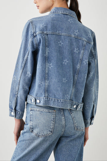 Mulholland Denim Jacket with Button Closure, Two Chest Button Flap Pockets, Two Front Pockets, Adjustable Button Straps on Hem in Lady Liberty Colorway, with White Stars - Back View Featured on Model  