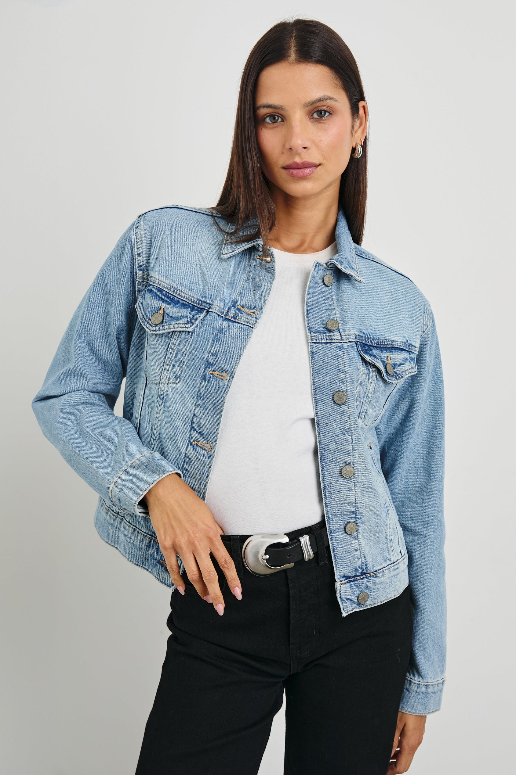 Mulholland Denim Jacket with Button Closure, Two Chest Button Flap Pockets, Two Front Pockets, Adjustable Button Straps on Hem in Original Blue Colorway - Front View Featured on Model  