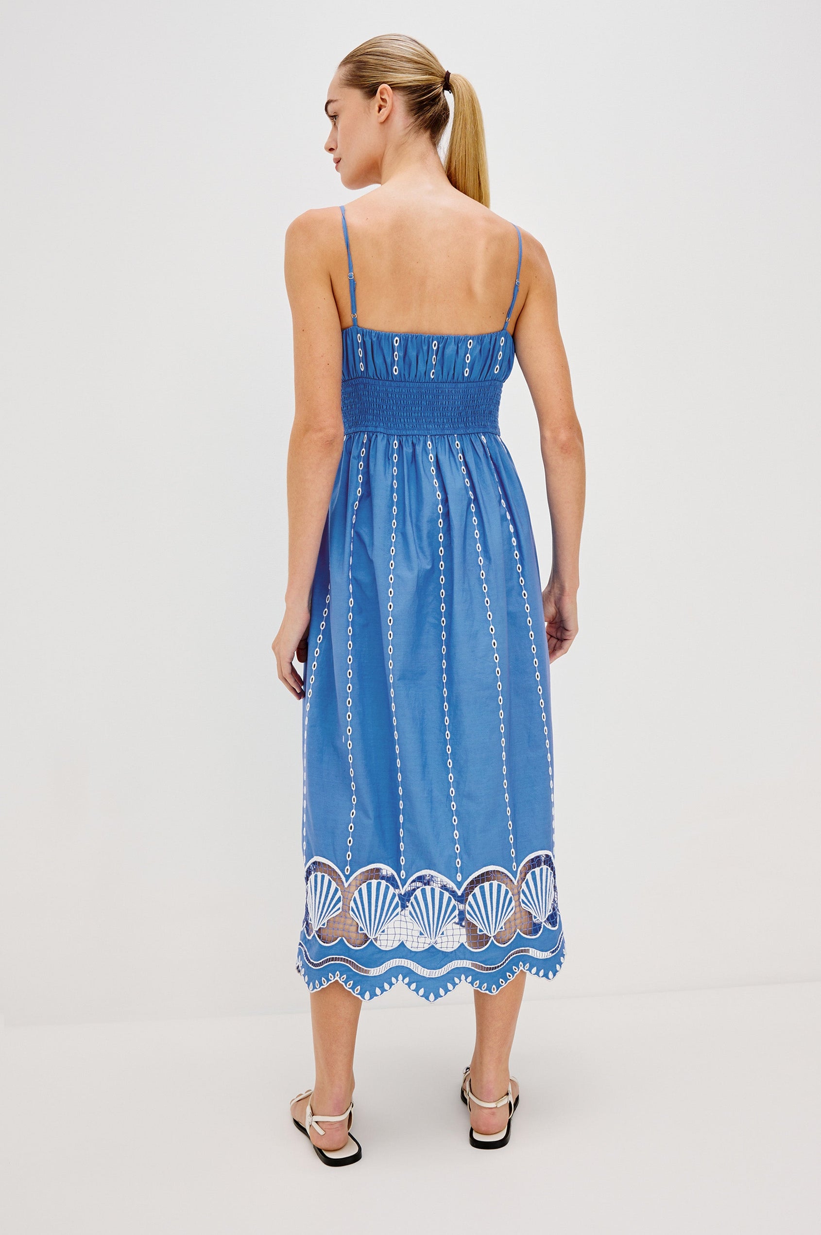 Murano Midi Tank Dress with Spaghetti Straps, Gathered Elastic Waistband, Sea Shell Embroidery and Scalloped Hem in French Blue Colorway. Full Body Back View Shown on Model.