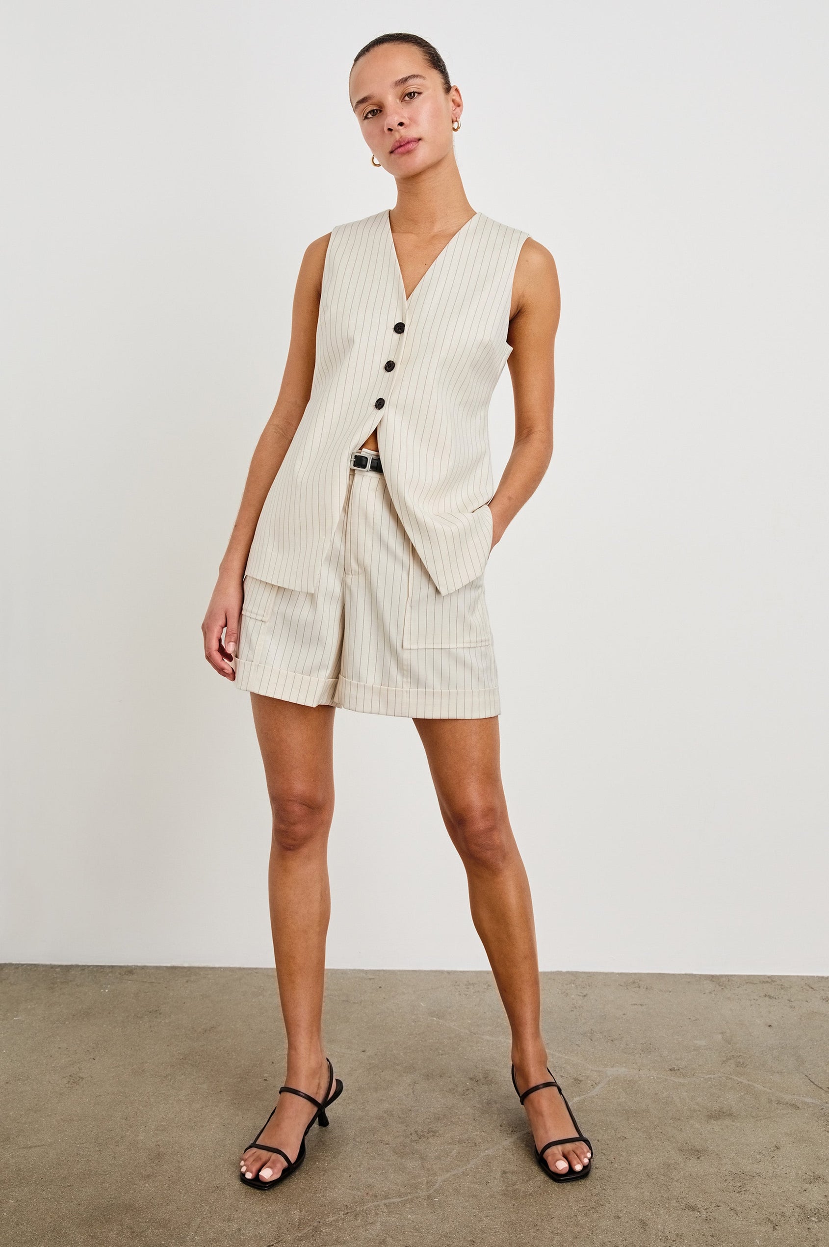 Mylah longline tan vest with black buttons in Birch Pinstripe - full front body on model