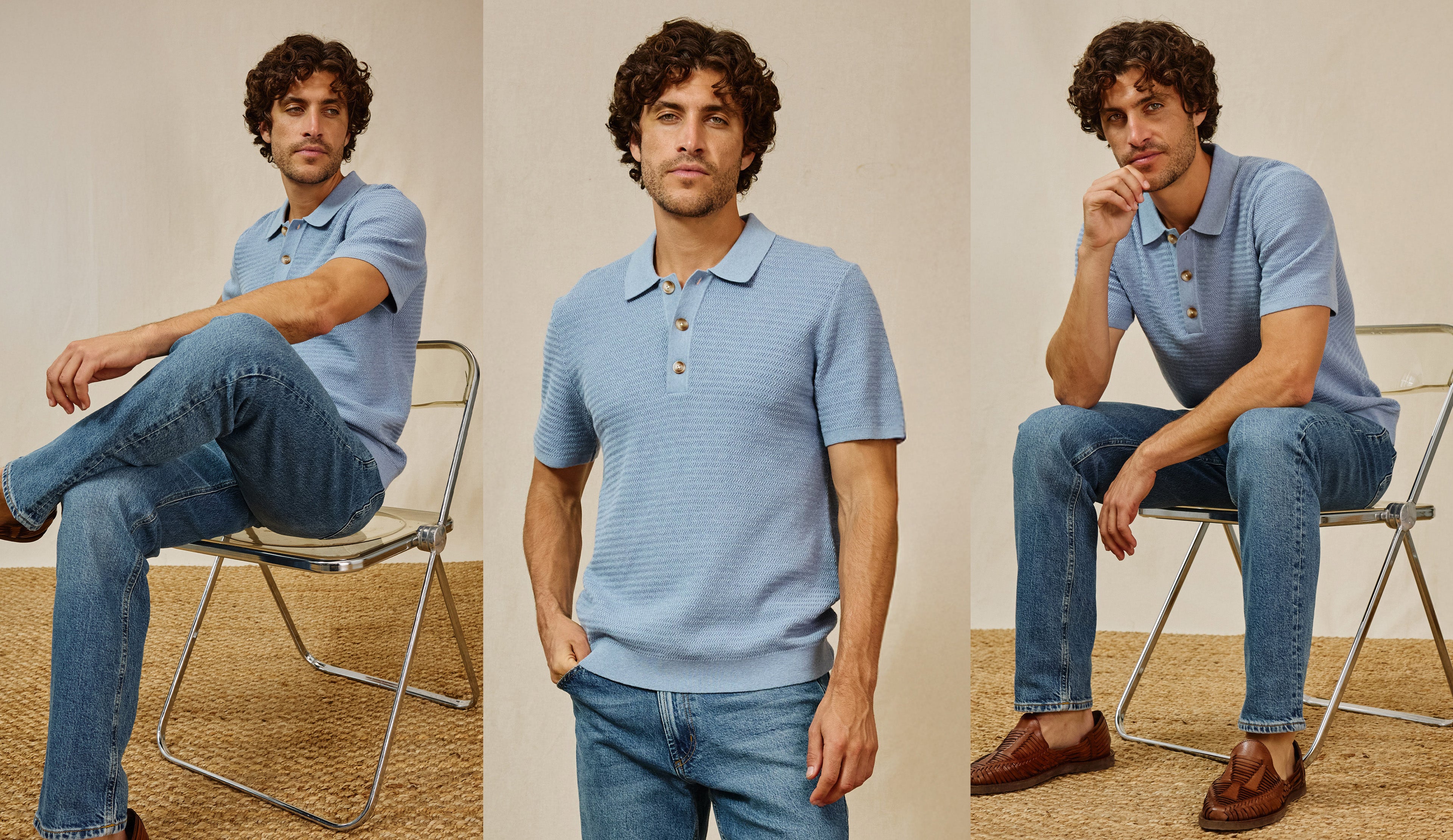 Man wearing a light blue polo shirt and jeans sitting on a chair against a neutral background