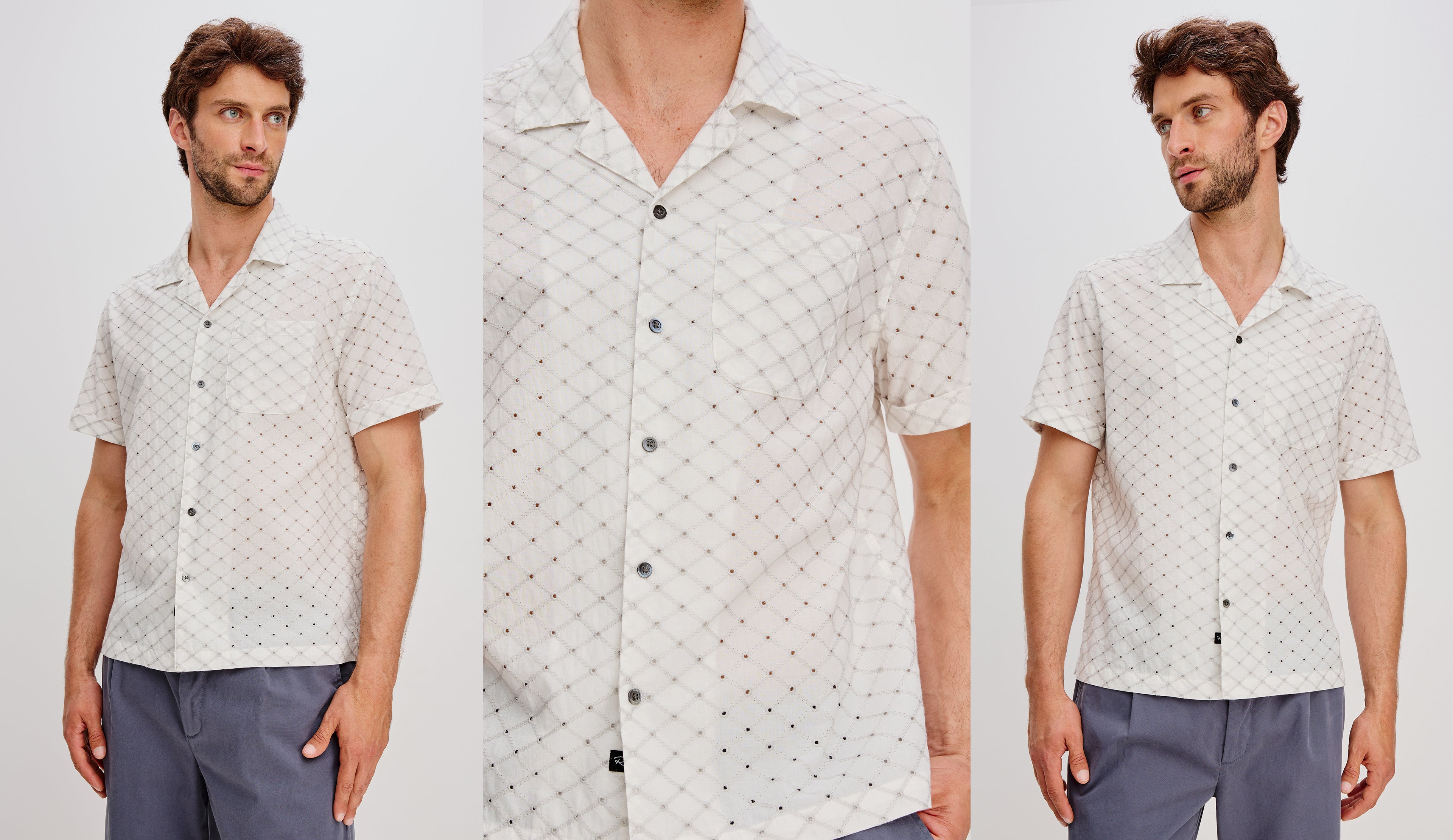 Man wearing a patterned white shirt with a plain background.