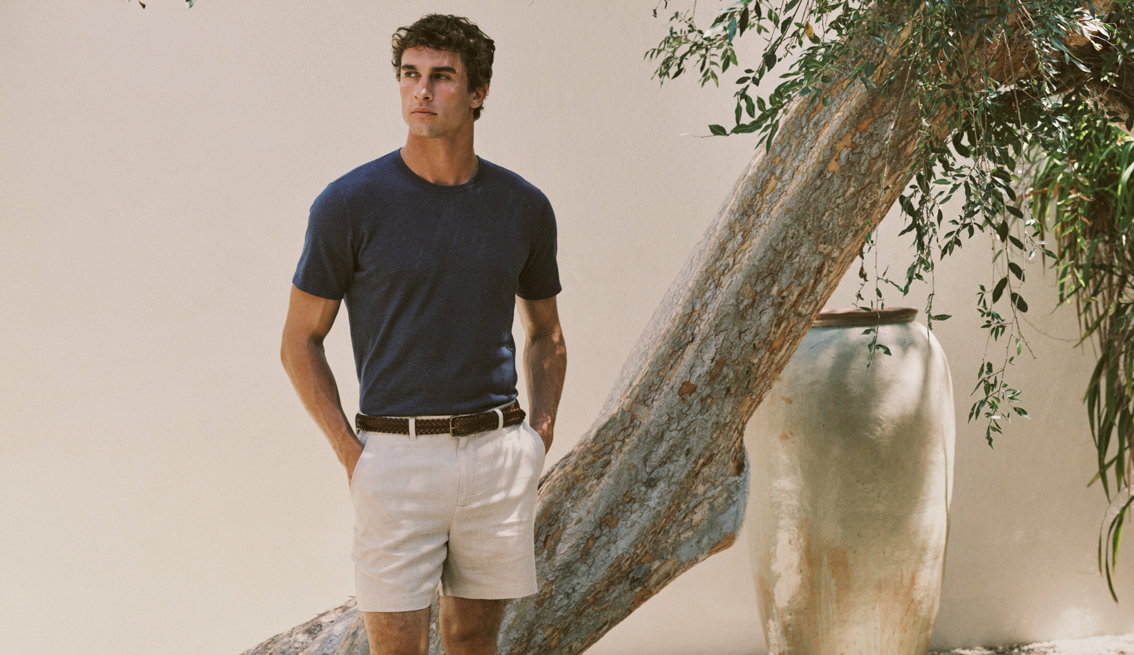 Man wearing blue t-shirt and white shorts 