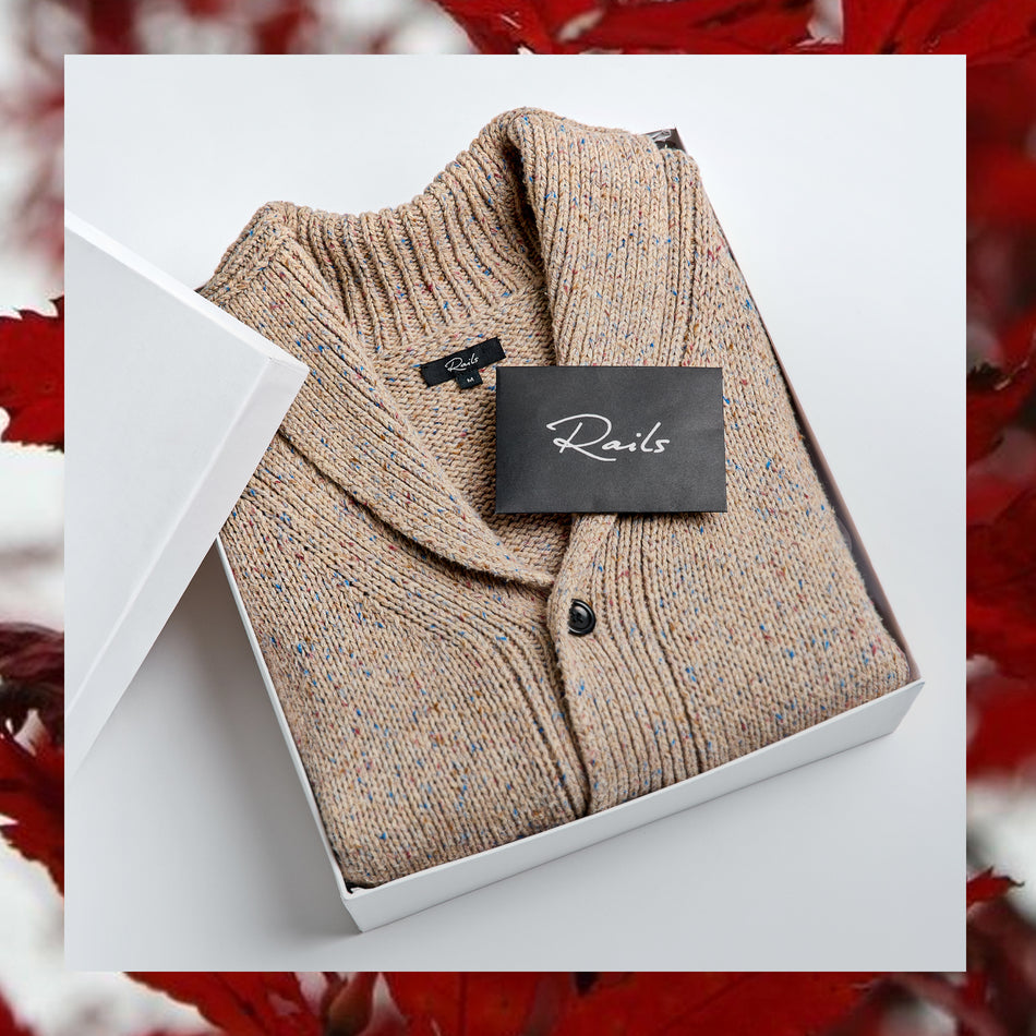 EDITORIAL IMAGE OF CORDEN CARDIGAN FOLDED IN A GIFT BOX
