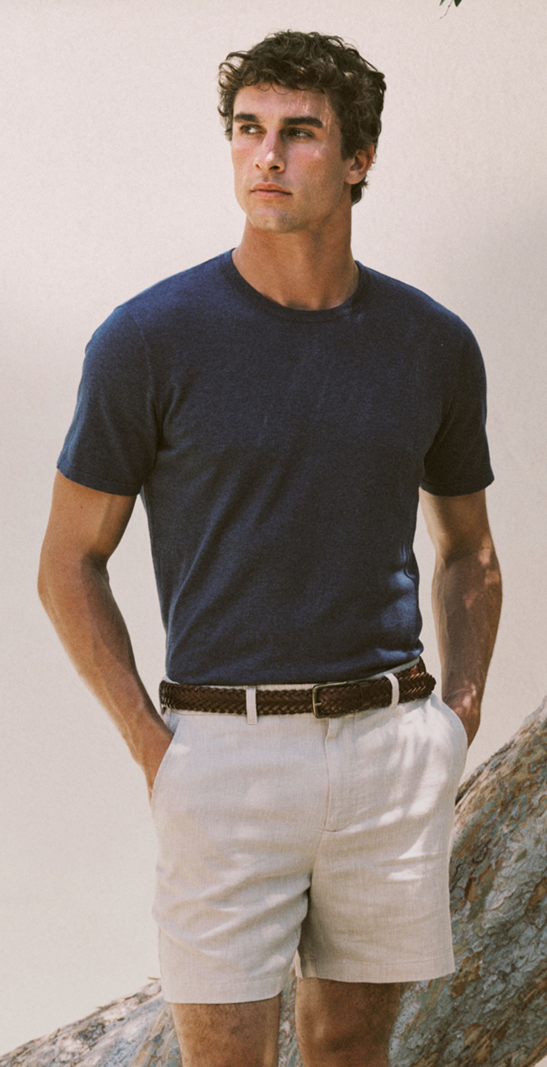 Man wearing blue t-shirt and white shorts 