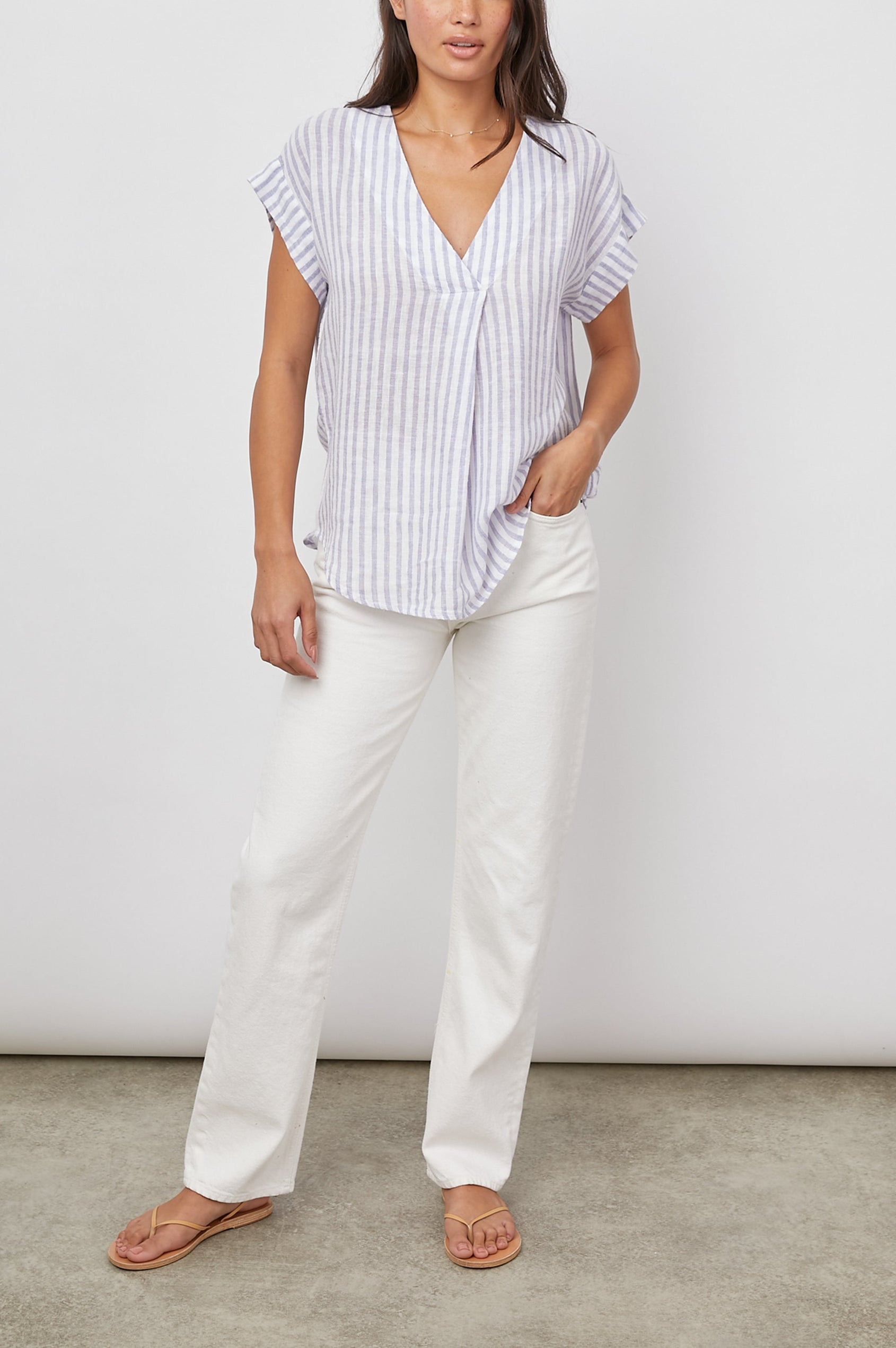 Nala Short-Sleeve Top with a Deep V Neck in Blue Iris Stripe Colorway, Vertical White and Blue Stripes - Front Full View Featured on Model 