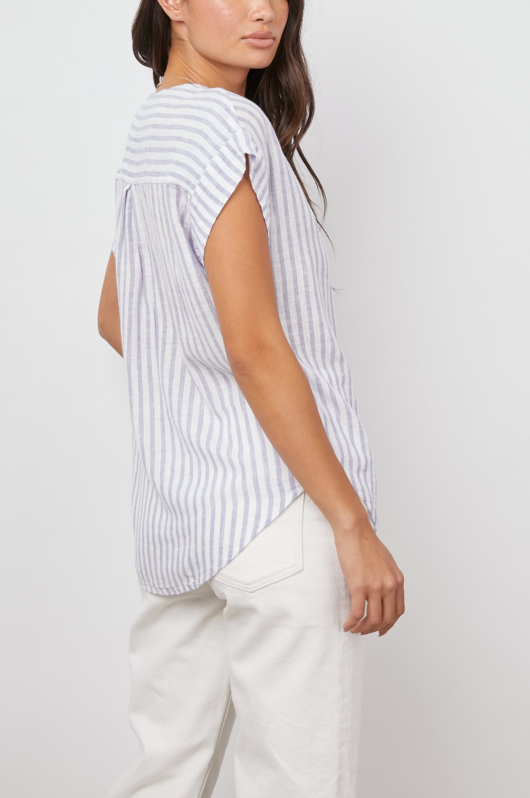 Nala Short-Sleeve Top with a Deep V Neck in Blue Iris Stripe Colorway, Vertical White and Blue Stripes - Back View Featured on Model 