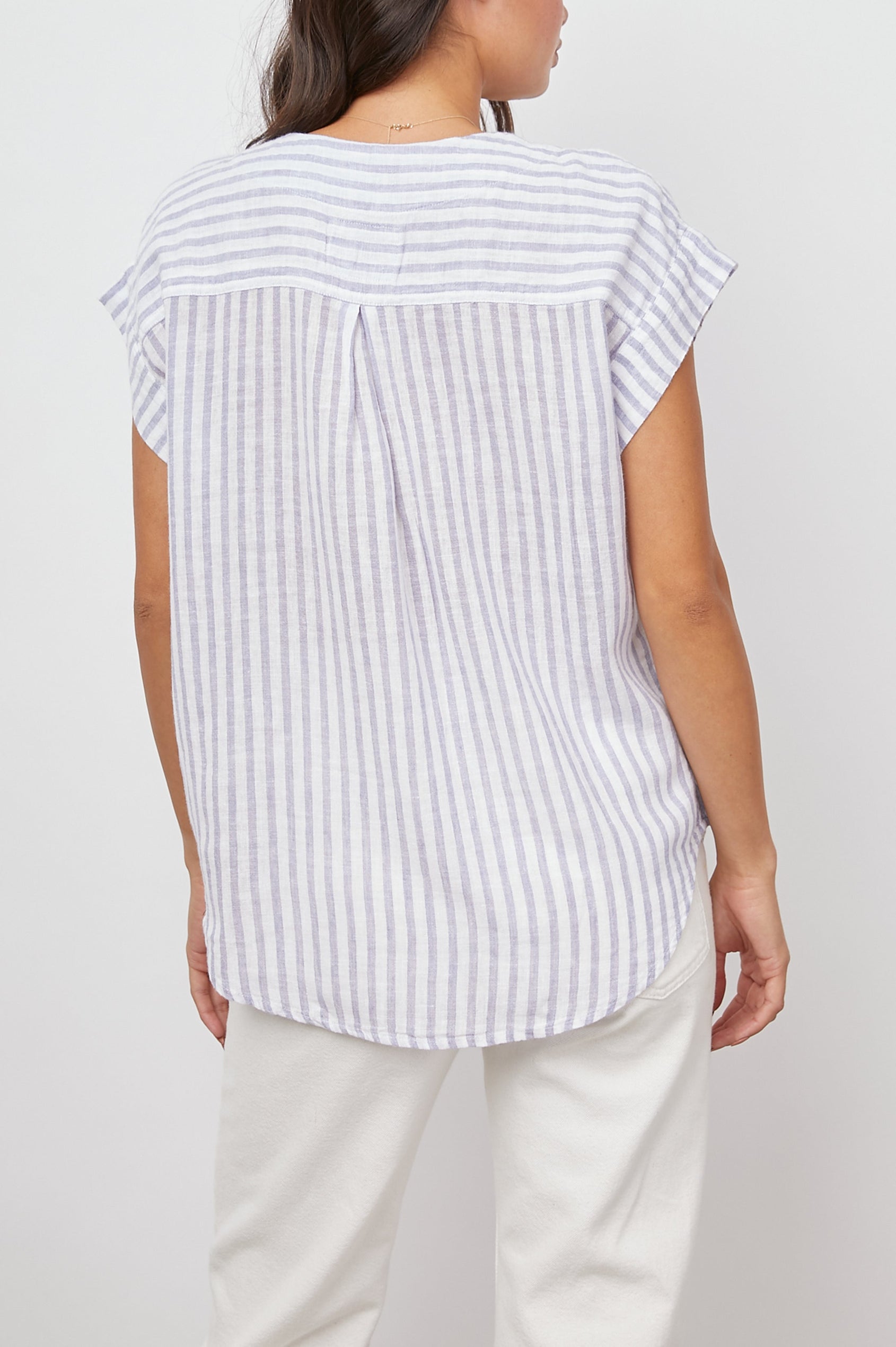 Nala Short-Sleeve Top with a Deep V Neck in Blue Iris Stripe Colorway, Vertical White and Blue Stripes - Back View Featured on Model 