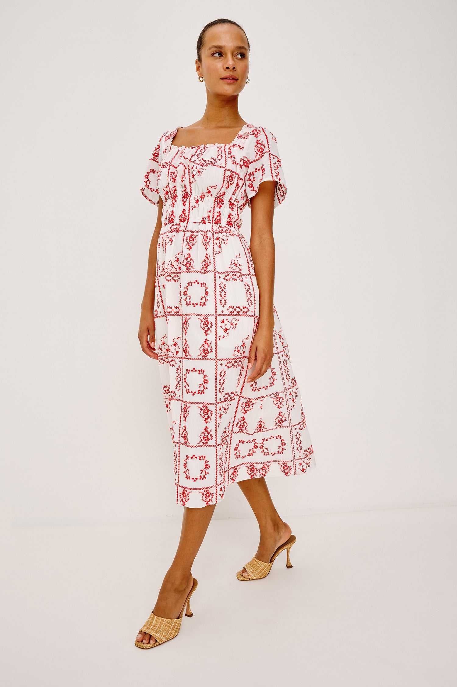 Nanette Midi Dress in Cotton Voile With Square Neckline, Underbust Elastic, Smocked Detailing, Short Sleeves, and is Fully Lined in Ivory Red Handkerchief Colorway - Full Body Front View Featured on Model
