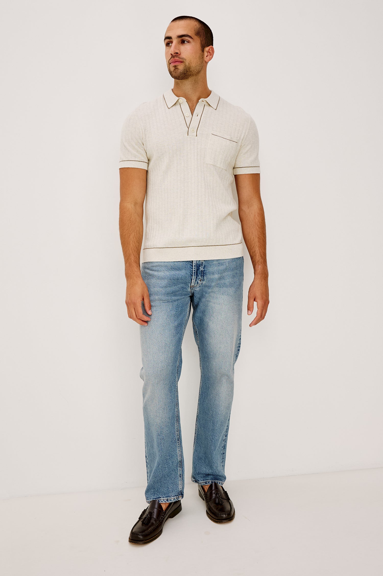 Nash is a straight leg 5-Pocket denim jean a zip fly and button closure as well as rivets in a Medium Vintage Wash. Front full body view featured on model.