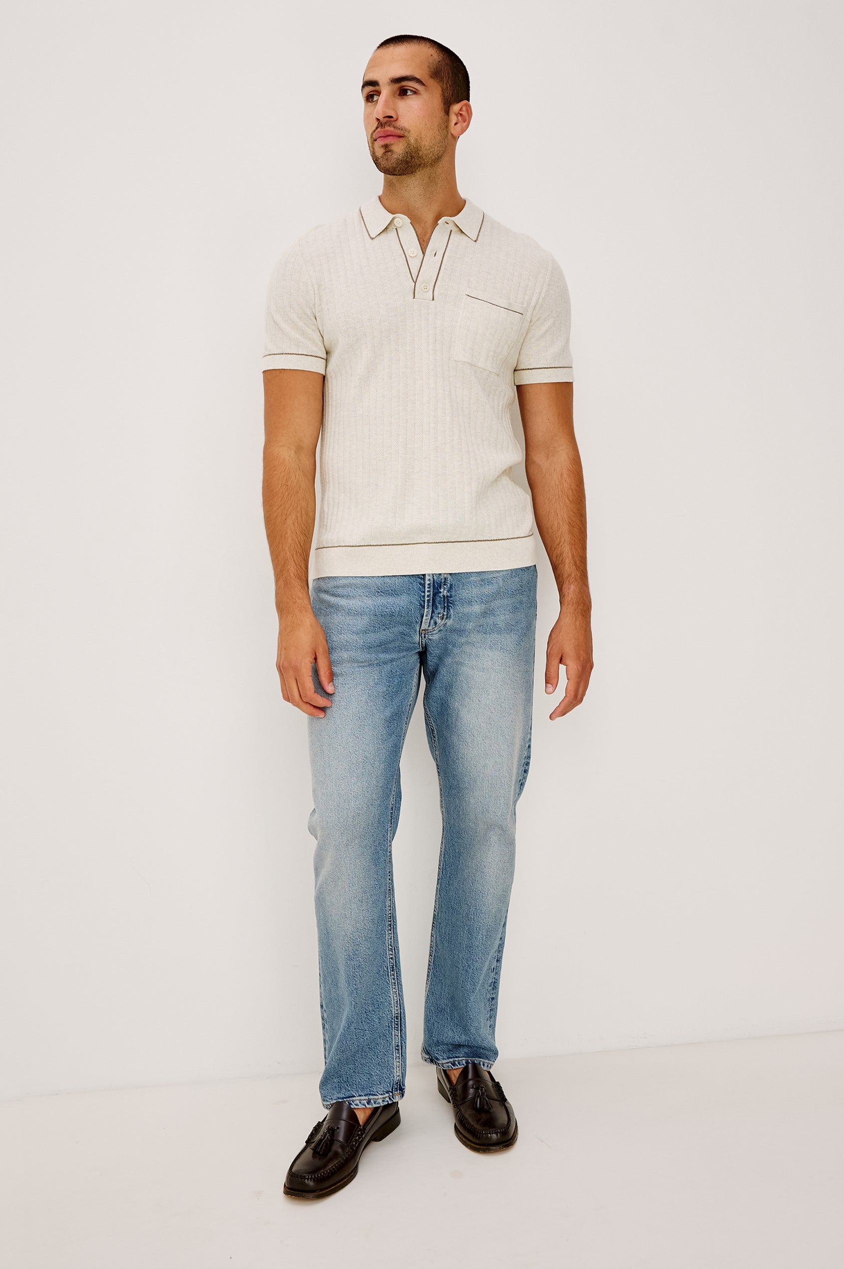 Nash is a straight leg 5-Pocket denim jean a zip fly and button closure as well as rivets in a Medium Vintage Wash. Front full body view featured on model.