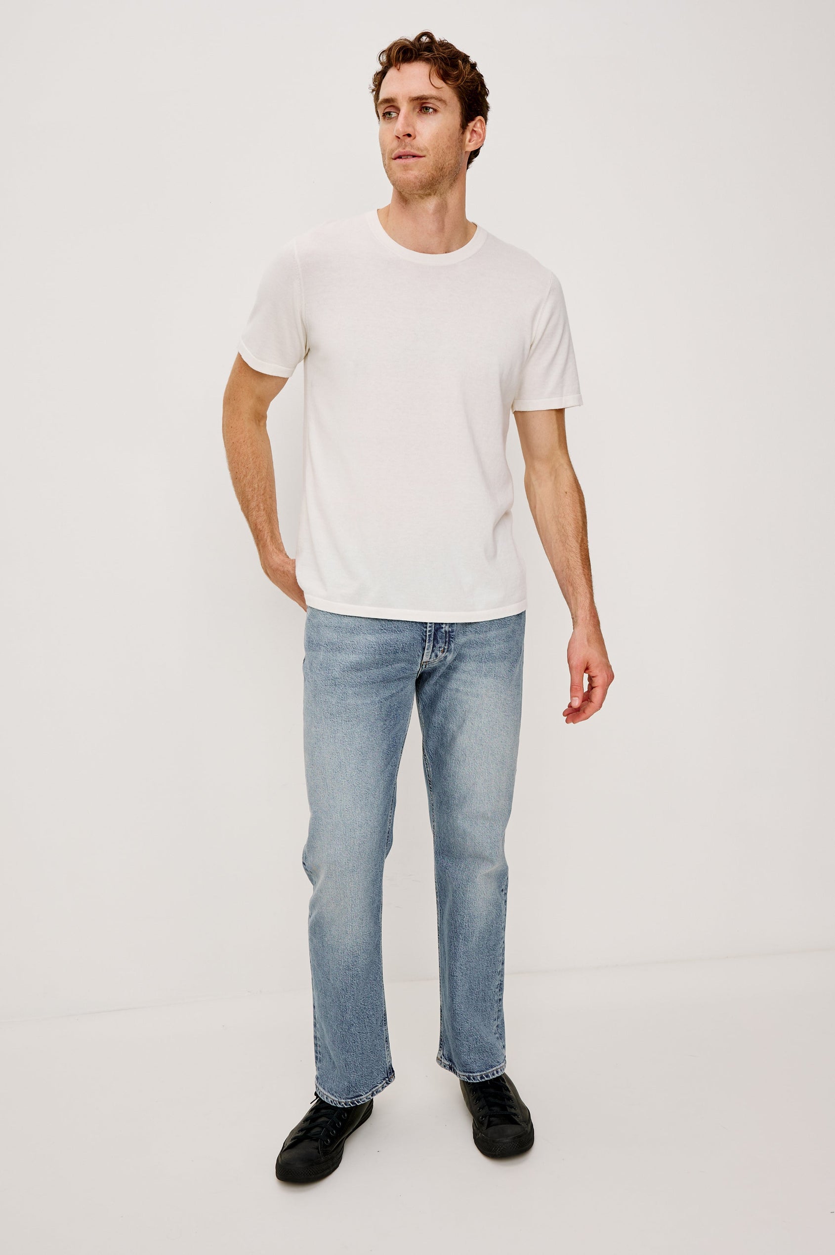 Nash is a straight leg 5-Pocket denim jean a zip fly and button closure as well as rivets in a Medium Vintage Wash. Front full body view featured on model.