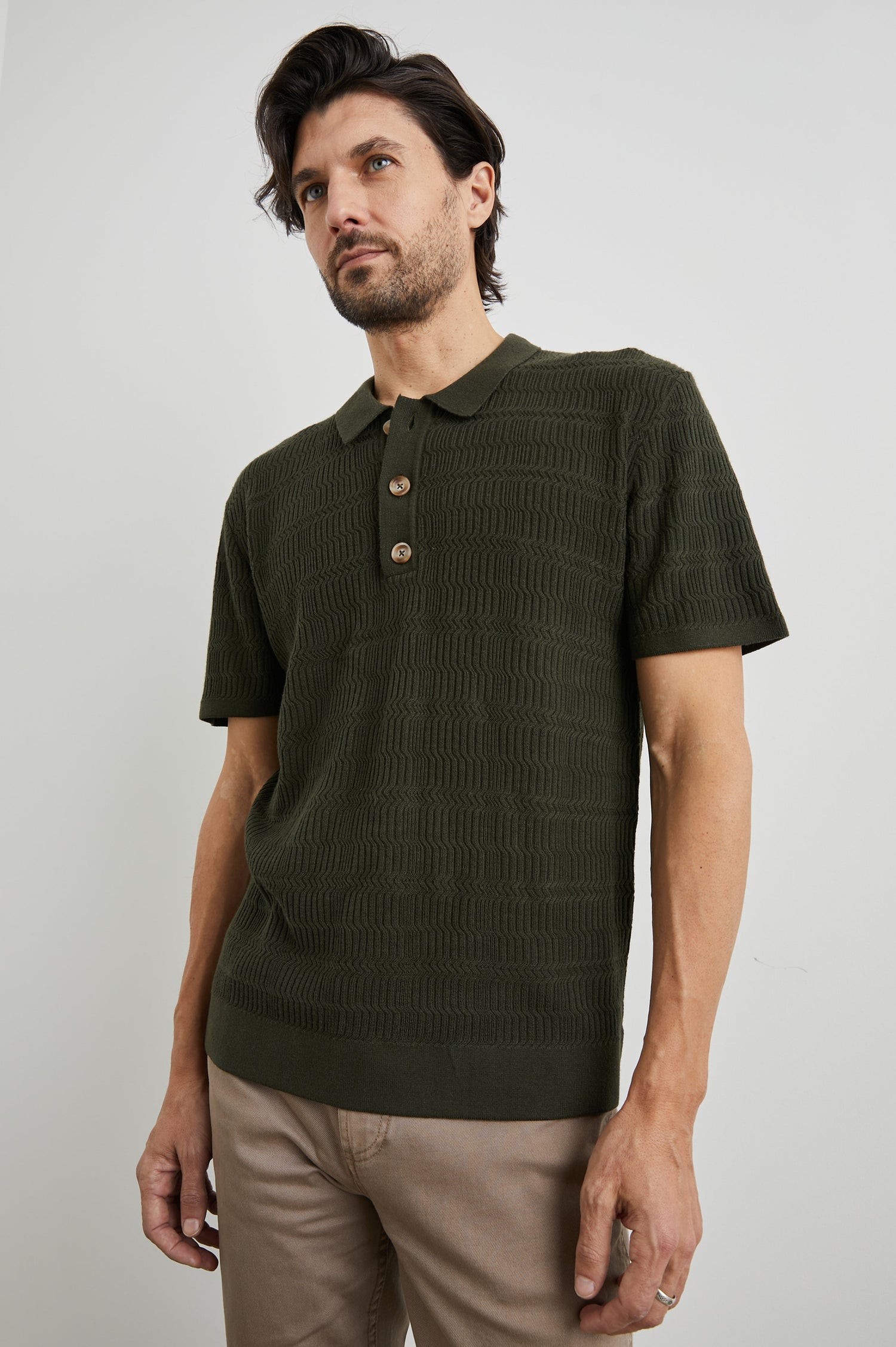 Nathan Short-Sleeve Polo Shirt with a Three-Button Placket and a Jacquard Pattern in Ancient Olive Colorway - Front View Featured on Model