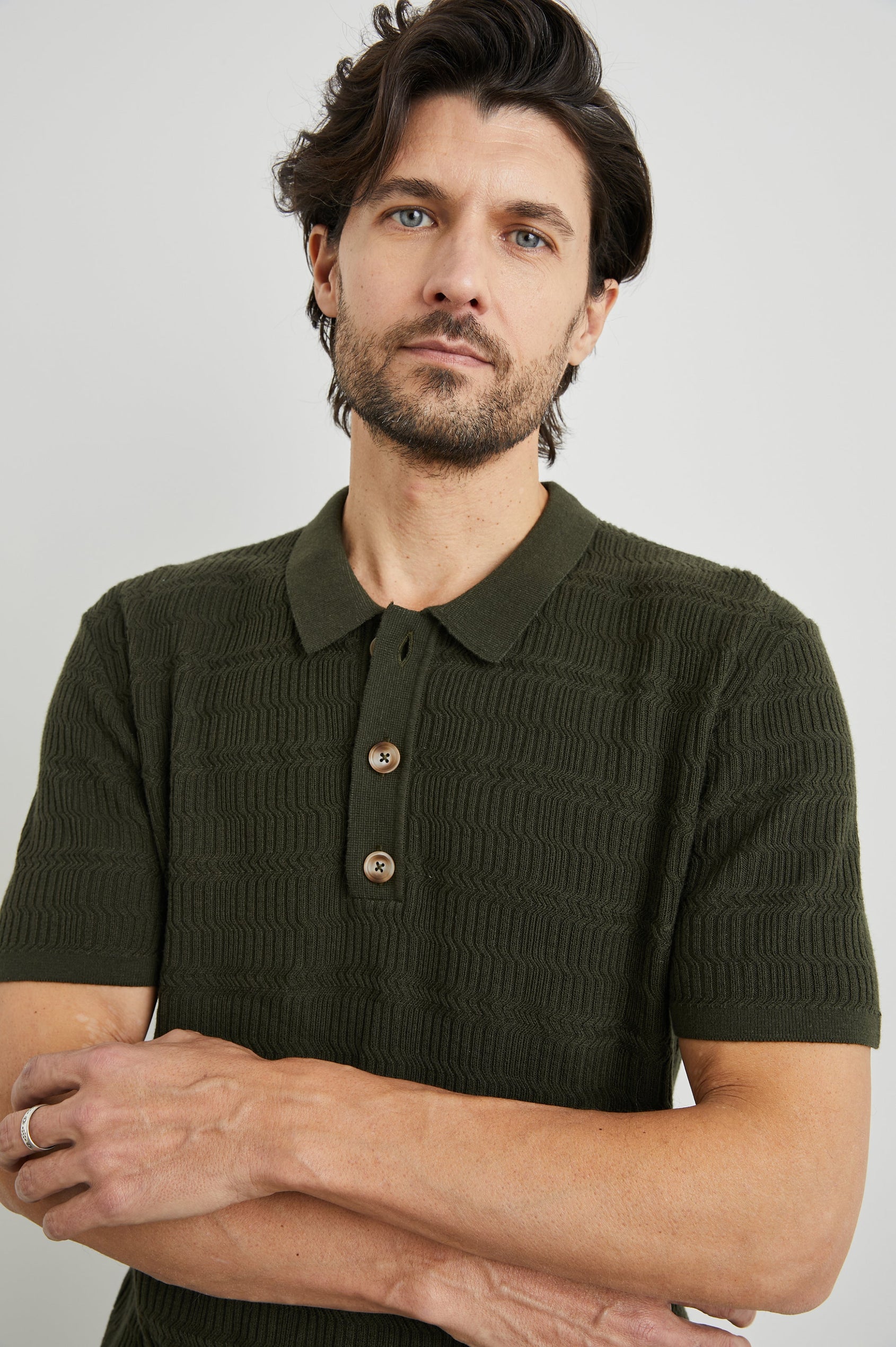 Nathan Short-Sleeve Polo Shirt with a Three-Button Placket and a Jacquard Pattern in Ancient Olive Colorway - Front View Featured on Model