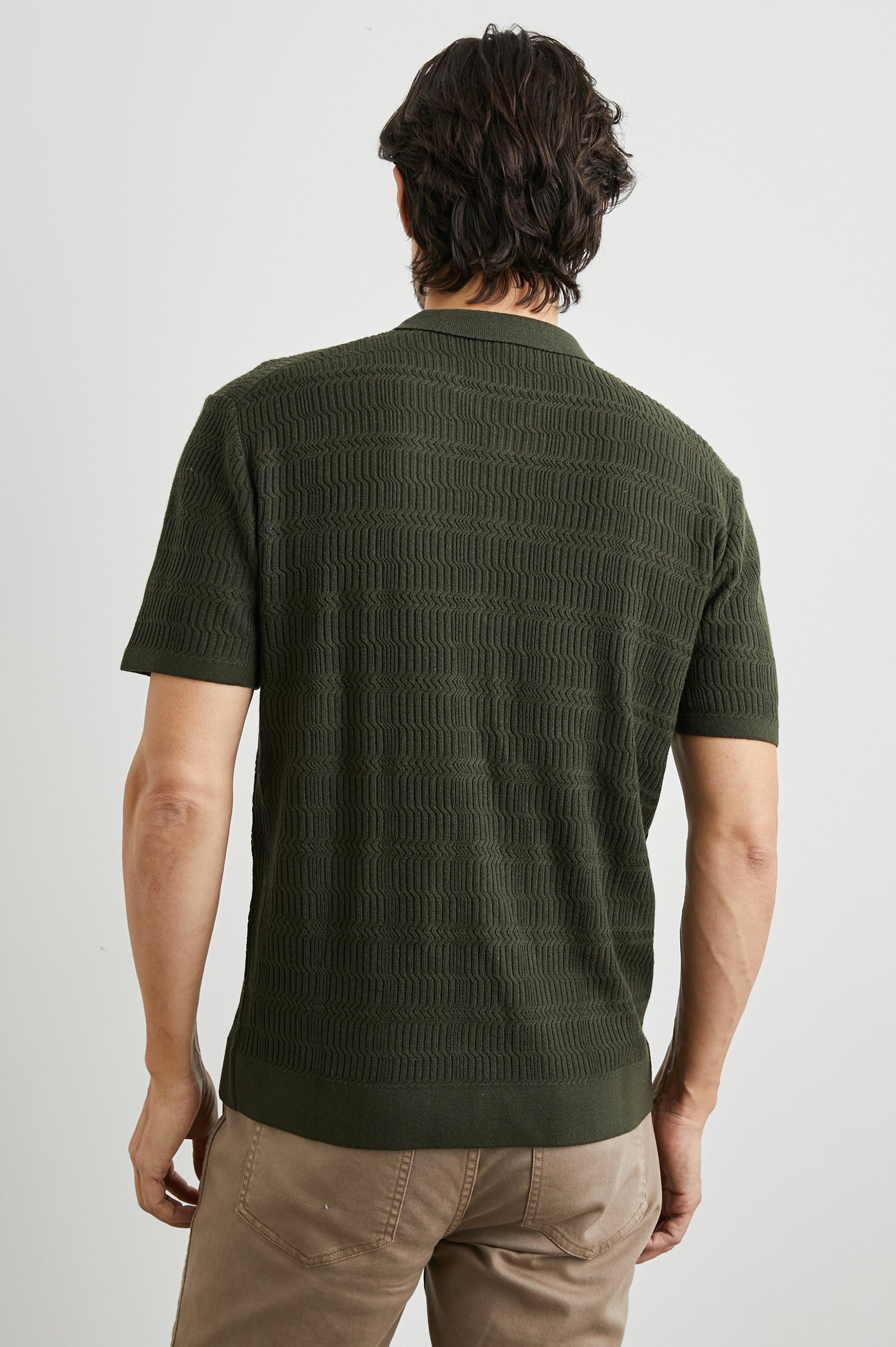 Nathan Short-Sleeve Polo Shirt with a Three-Button Placket and a Jacquard Pattern in Ancient Olive Colorway - Back View Featured on Model