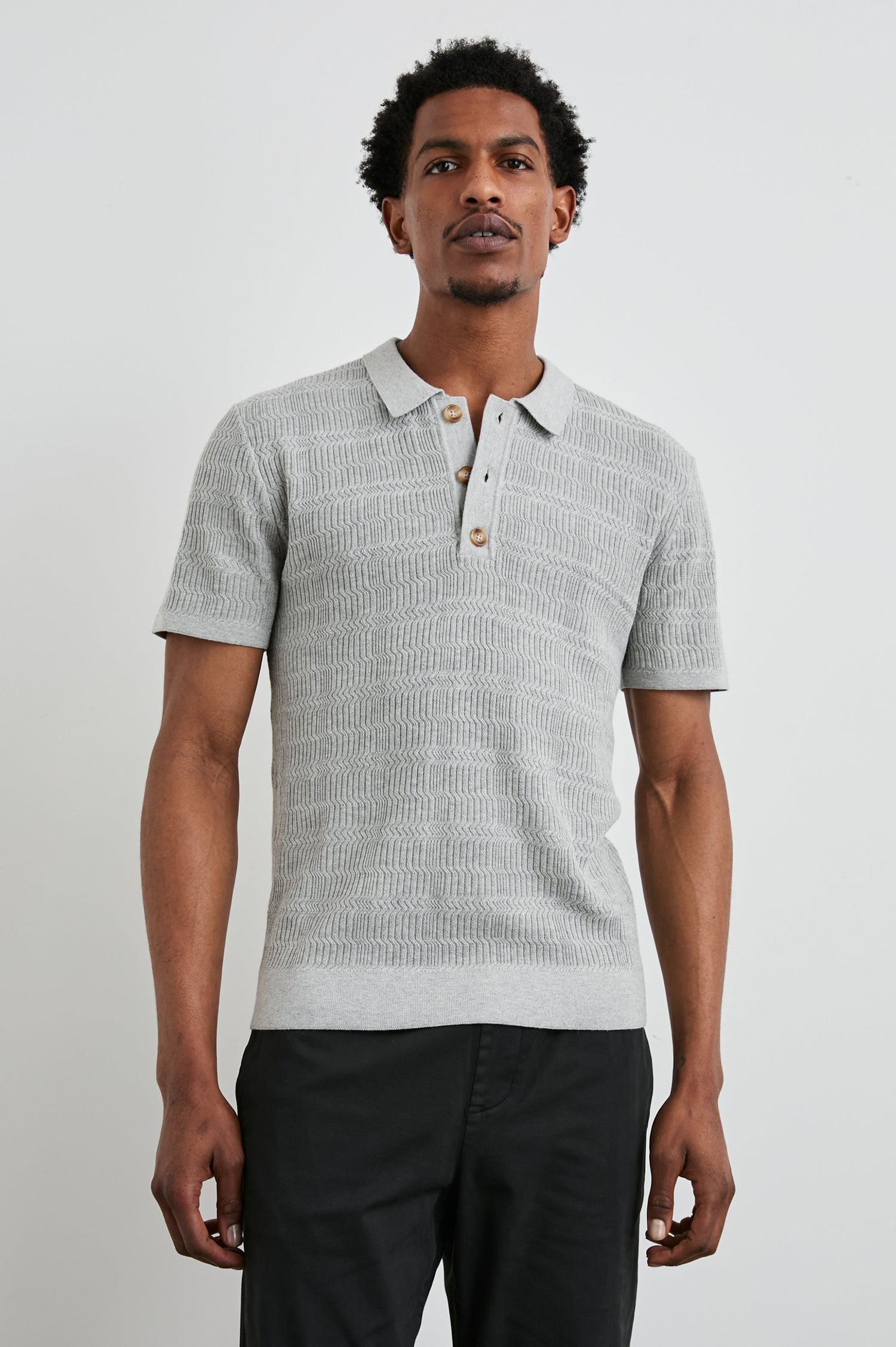 Nathan Short-Sleeve Polo Shirt with a Three-Button Placket and a Jacquard Pattern in Concrete Melange Colorway - Front View Featured on Model