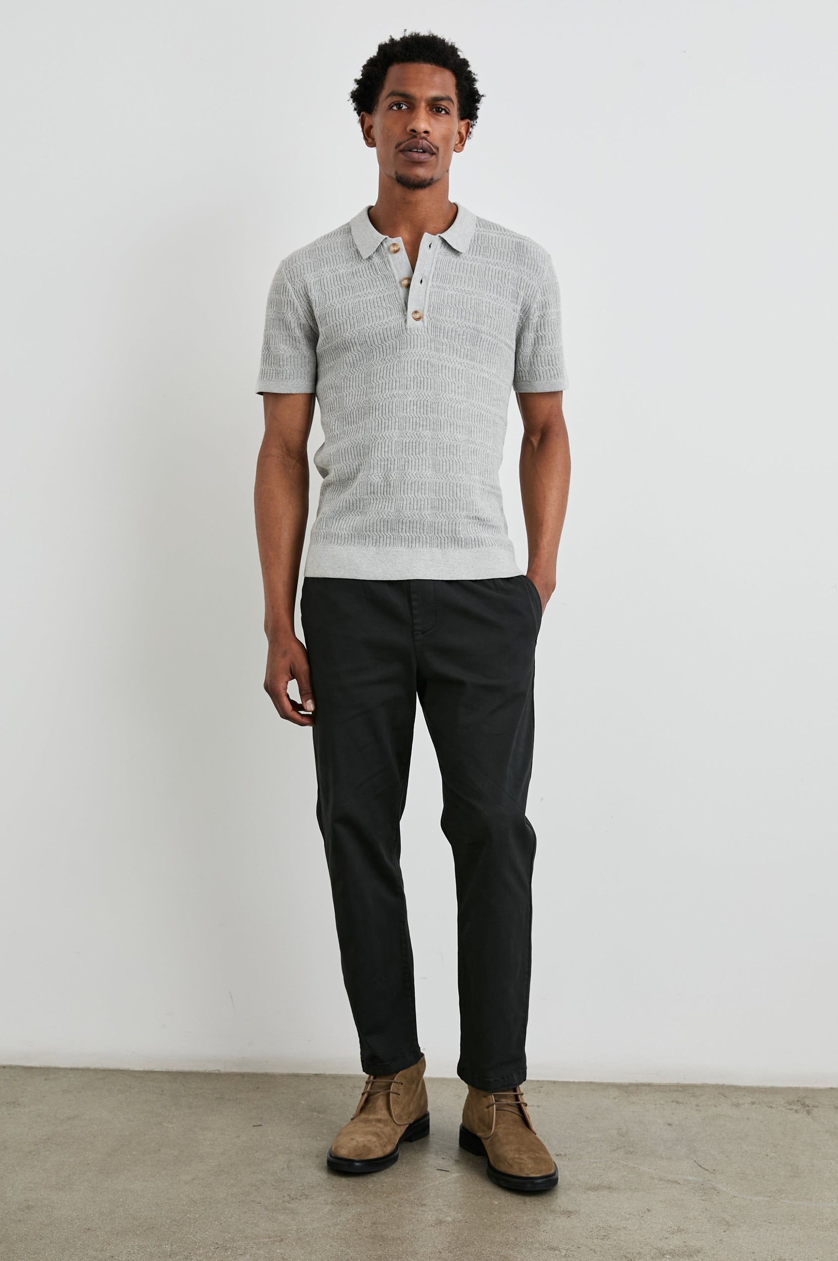 Nathan Short-Sleeve Polo Shirt with a Three-Button Placket and a Jacquard Pattern in Concrete Melange Colorway - Front Full Body View Featured on Model