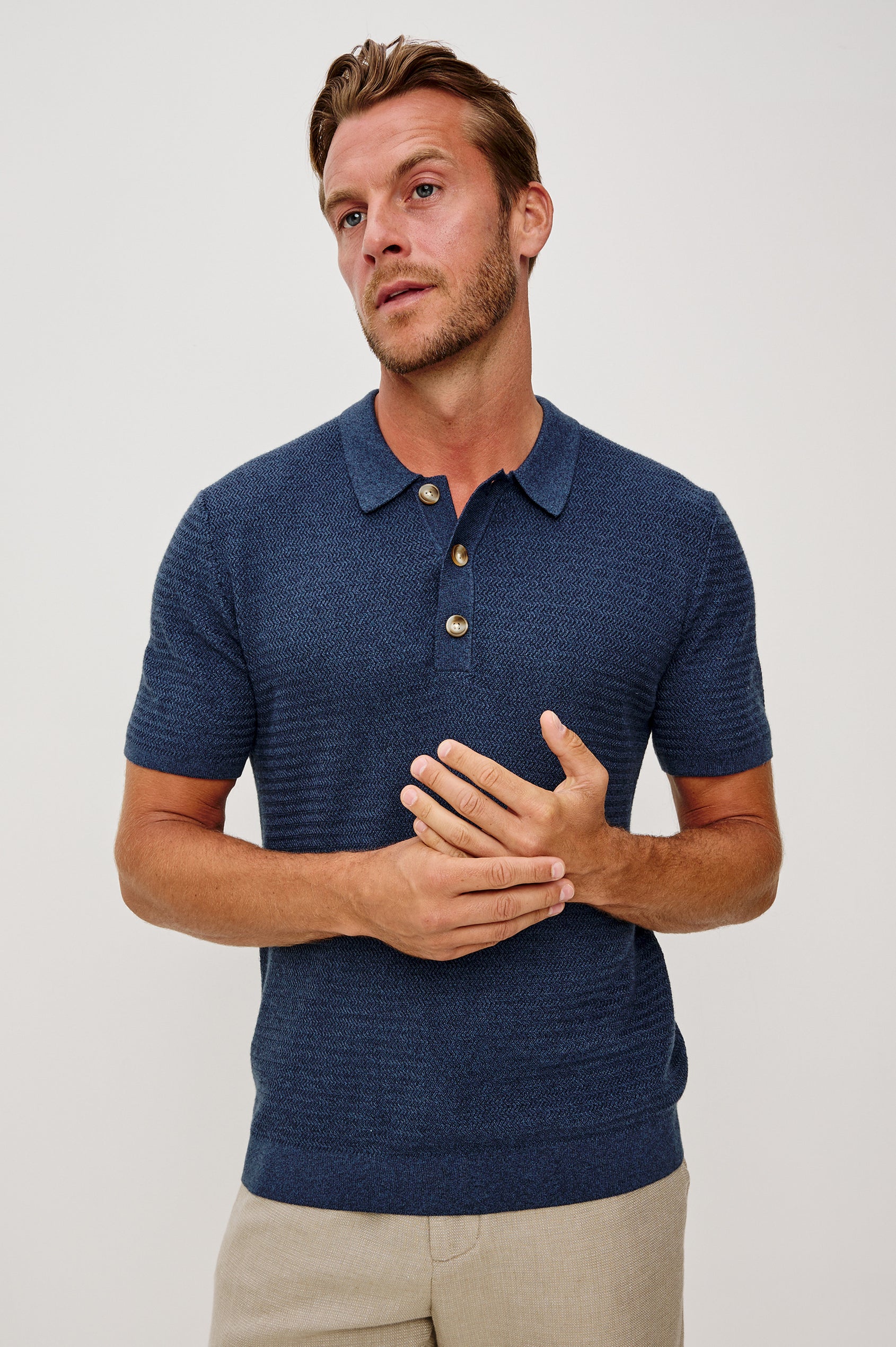 Nathan Polo Shirt in Cotton Blend Knit With Collar, Quarter Button Placket, and Short Sleeves in Harbour Colorway - Upper Body Front Close Up View Featured on Model