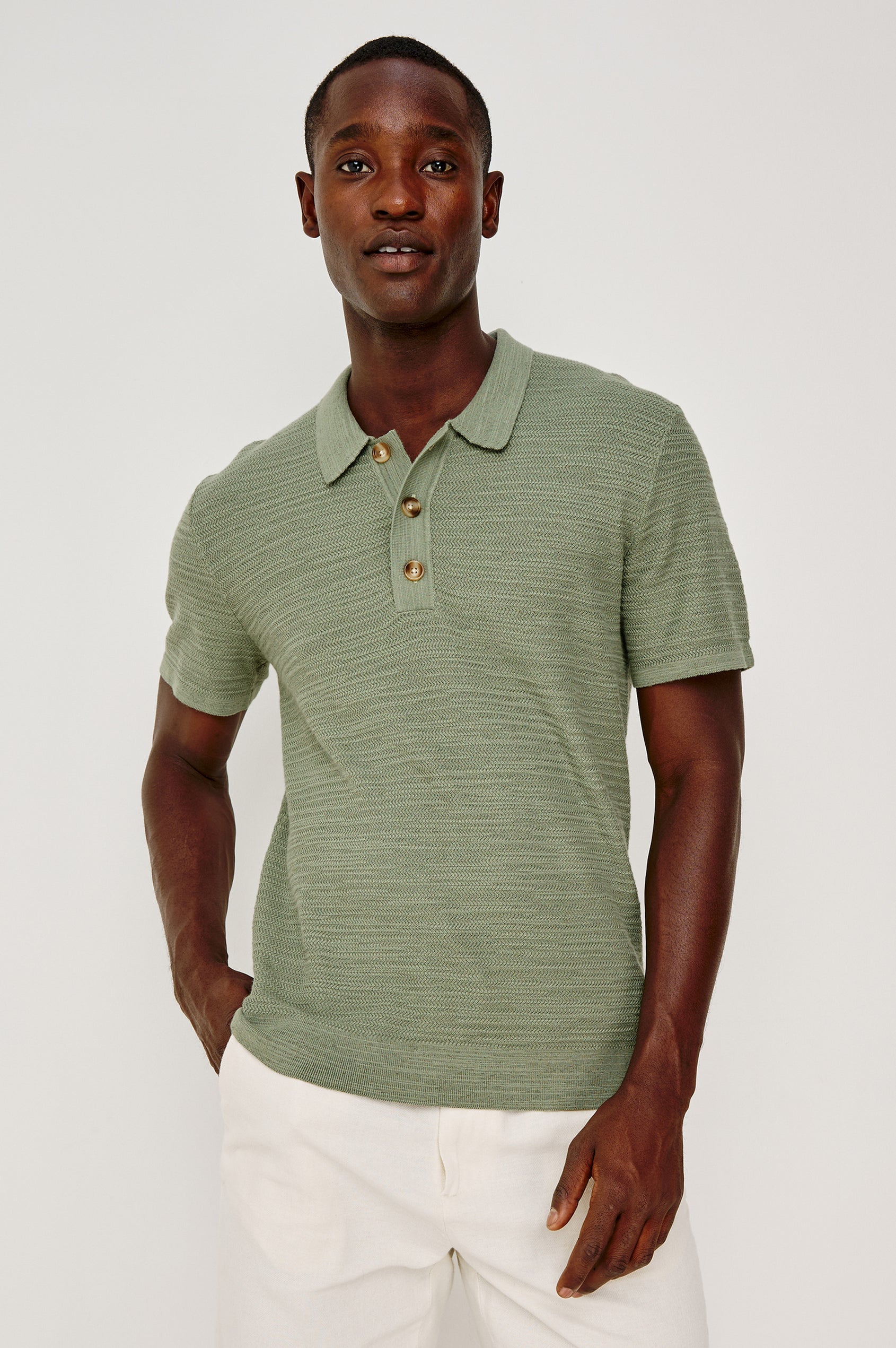 Nathan Polo Shirt in Cotton Blend Knit With Collar, Quarter Button Placket, and Short Sleeves in Silver Sage Colorway - Upper Body Front View Featured on Model
