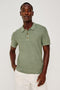 Nathan Polo Shirt in Cotton Blend Knit With Collar, Quarter Button Placket, and Short Sleeves in Silver Sage Colorway - Upper Body Front View Featured on Model