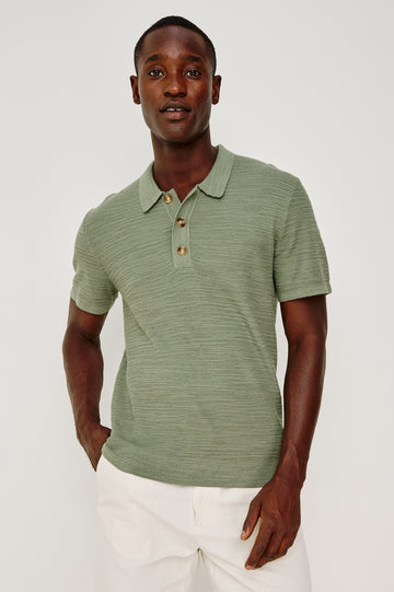 Nathan Polo Shirt in Cotton Blend Knit With Collar, Quarter Button Placket, and Short Sleeves in Silver Sage Colorway - Upper Body Front View Featured on Model