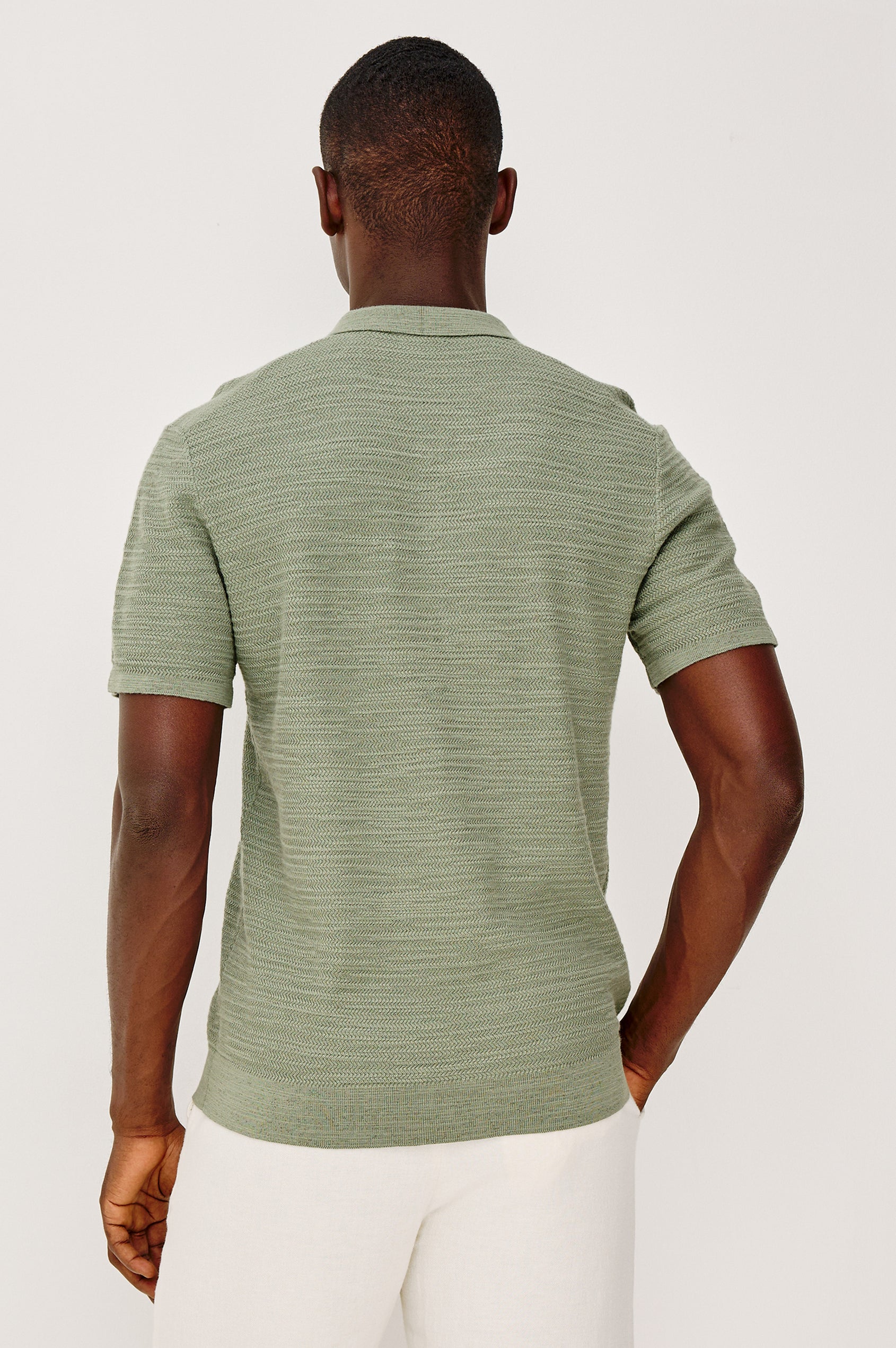 Nathan Polo Shirt in Cotton Blend Knit With Collar, Quarter Button Placket, and Short Sleeves in Silver Sage Colorway - Upper Body Back View Featured on Model