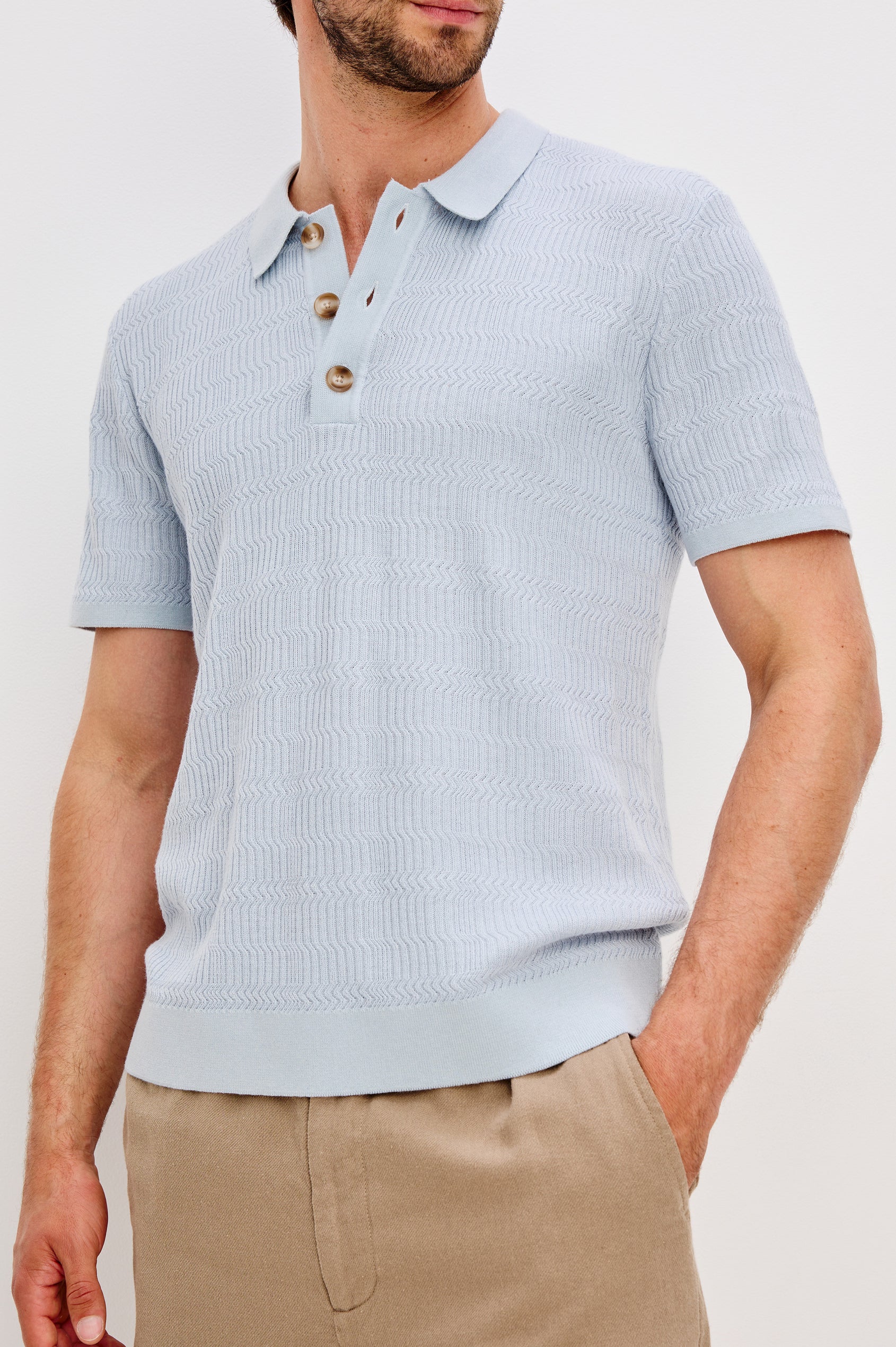 Nathan Short-Sleeve Polo Shirt with a Three-Button Placket and a Jacquard Pattern in Skyway Colorway - Front Detail View Featured on Model