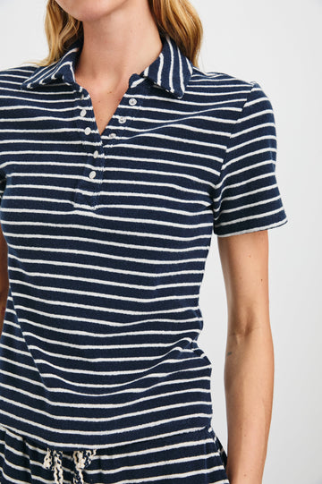 Naveli Court Polo with a Button-Up Placket in Navy Ivory Stripe Colorway, Horizontal Stripes - Front View Featured on Model