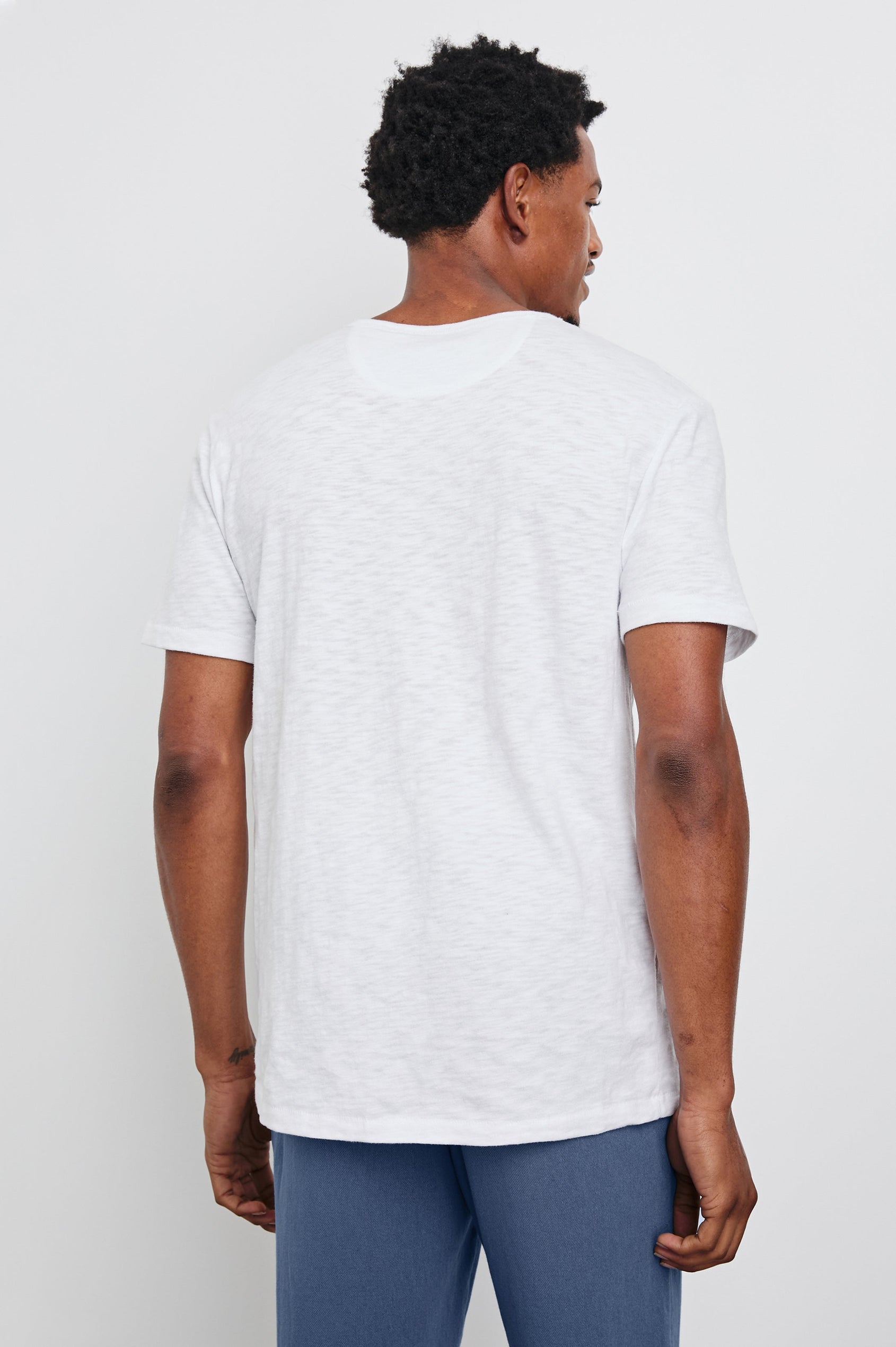 Neil T-Shirt with a Crew Neck in White Colorway - Back View Featured on Model 