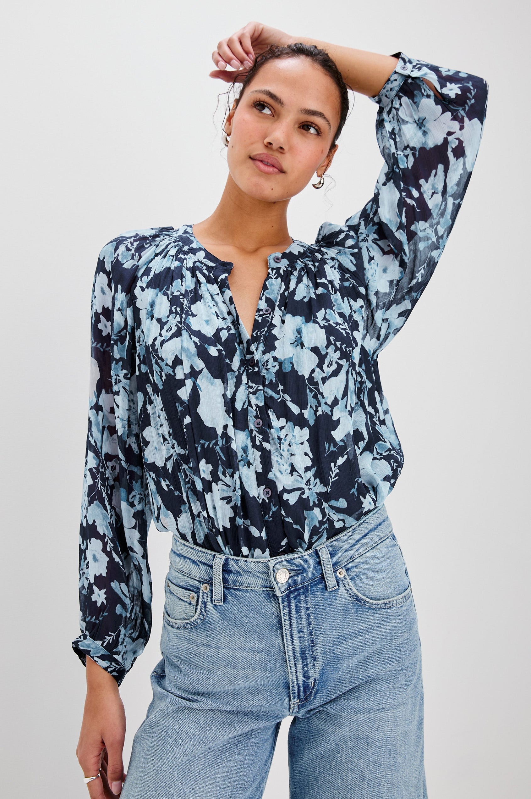 Nessie Long Sleeve Top with Front Button Closure and Ruching along the Neckline in Indigo Blossoms Colorway, Flowers in Blue on Indigo - Front Tucked View Featured on Model 