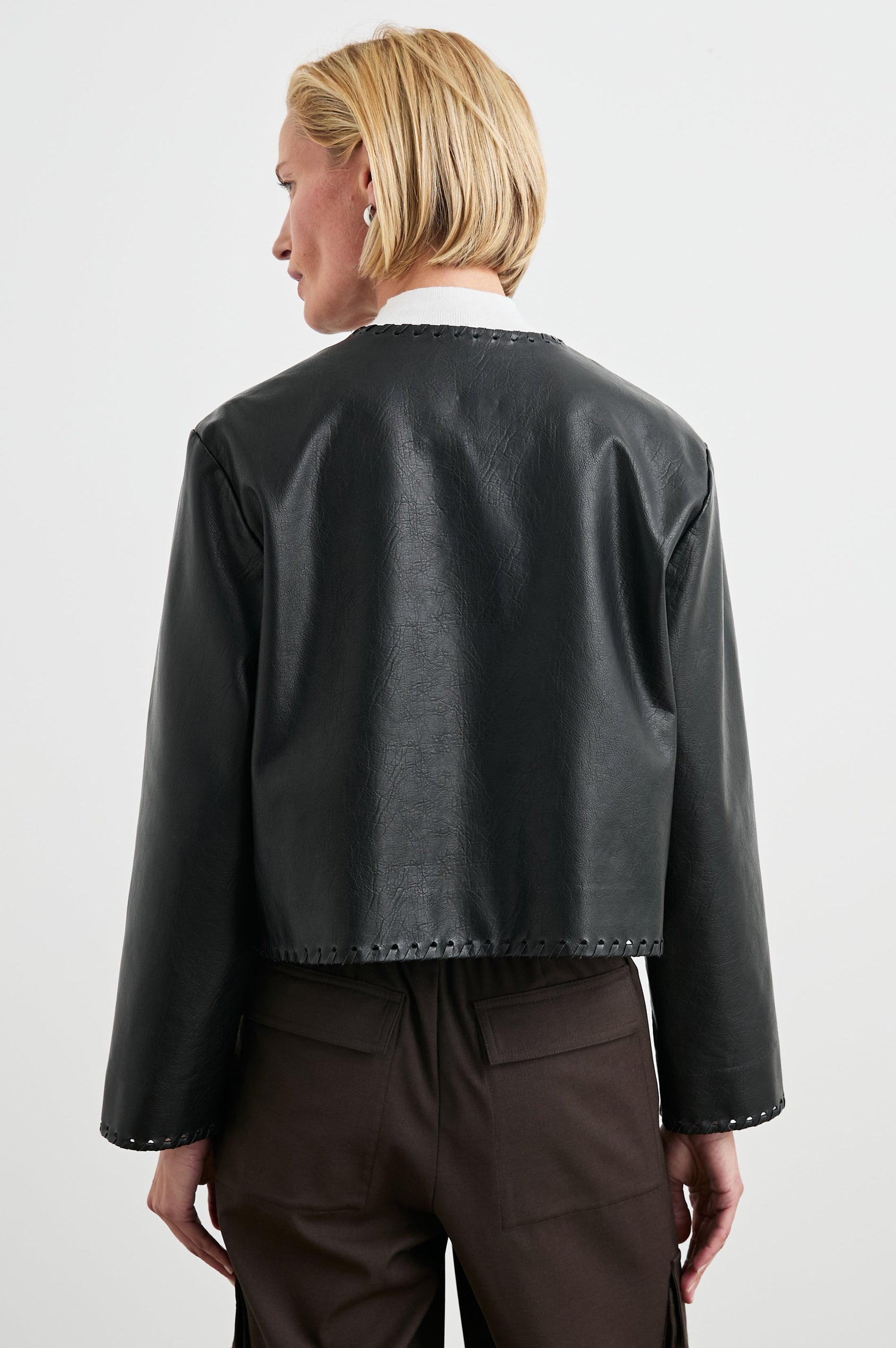Nevina Jacket with Button Closure, Whip Stitch Trim and Two Front Patch Pockets in Black Colorway - Back View Featured on Model