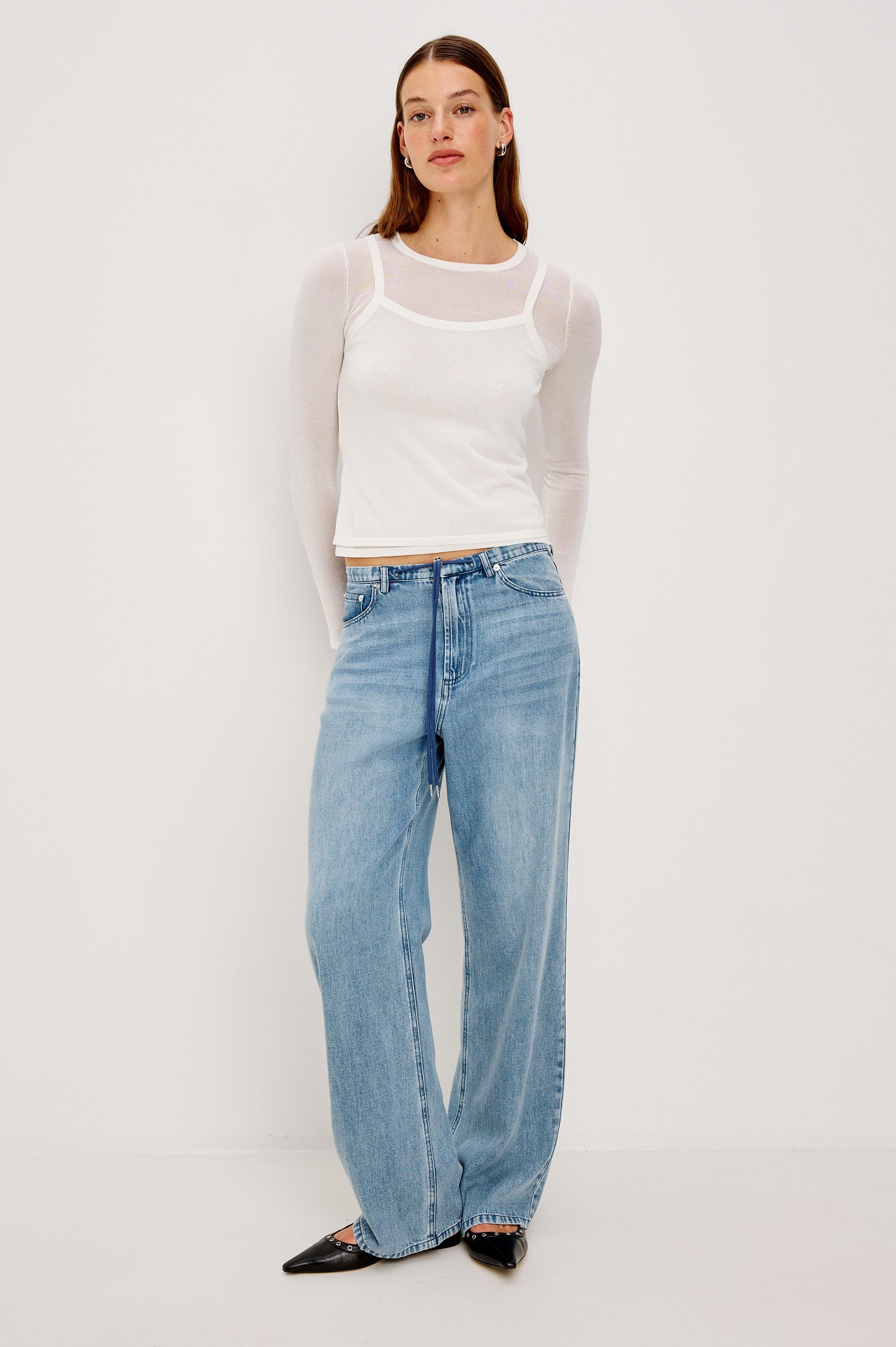 Normandie Lightweight 5-Pocket Denim Wide Leg Pant with front zipper button fly and a drawstring tie at waist in Antique Blue Colorway. Full Body Front View Featured on Model.