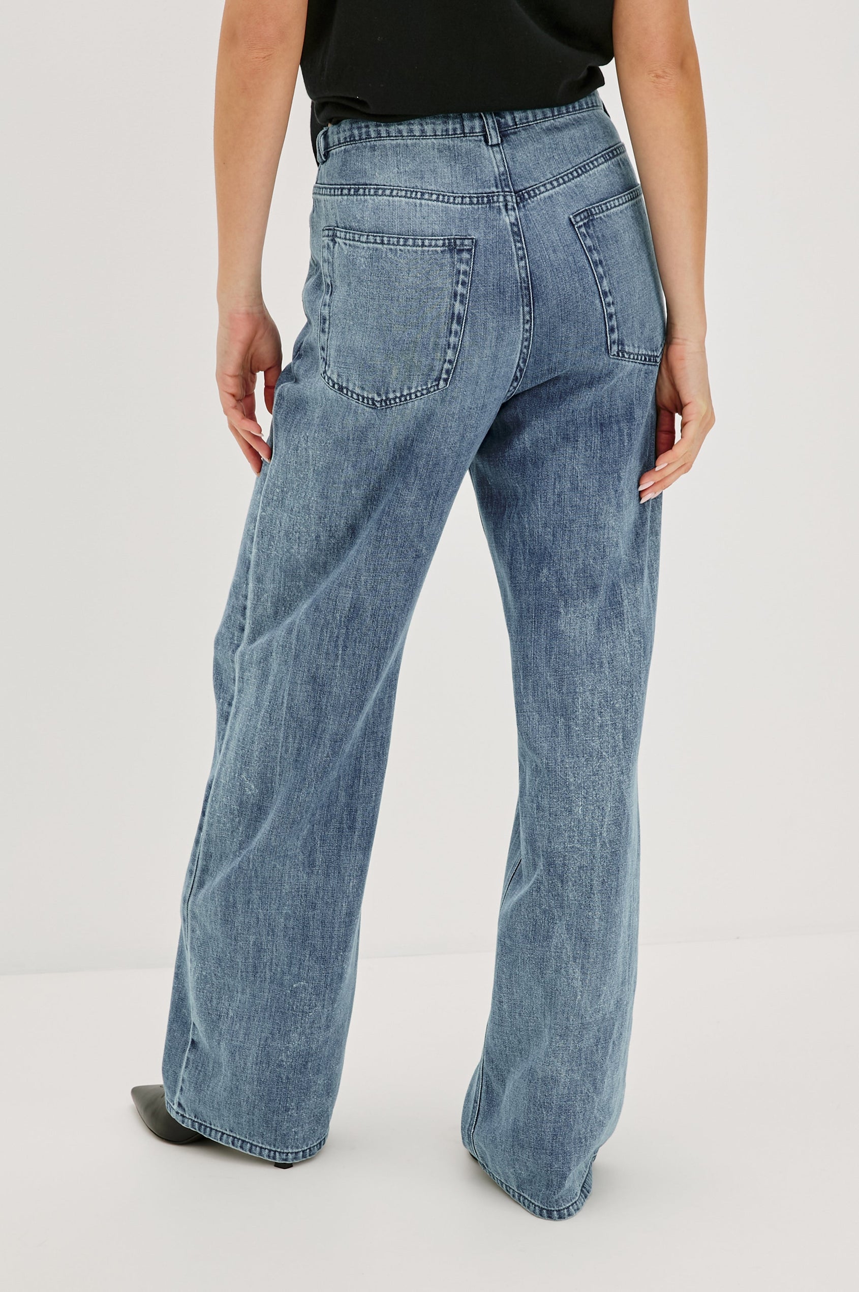 Normandie Lightweight 5-Pocket Denim Wide Leg Pant with front zipper button fly and a drawstring tie at waist in Antique Blue Colorway. Back View Featured on Model.