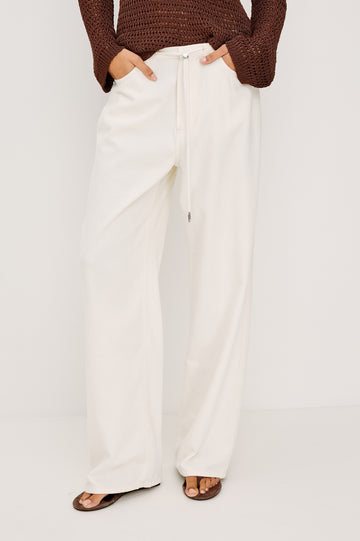 Normandie Relaxed Pant in Cotton Lyocell Denim With Adjustable Drawstring Toggles and 5-Pocket Styling in Ivory Colorway - Full Body Front View Featured on Model