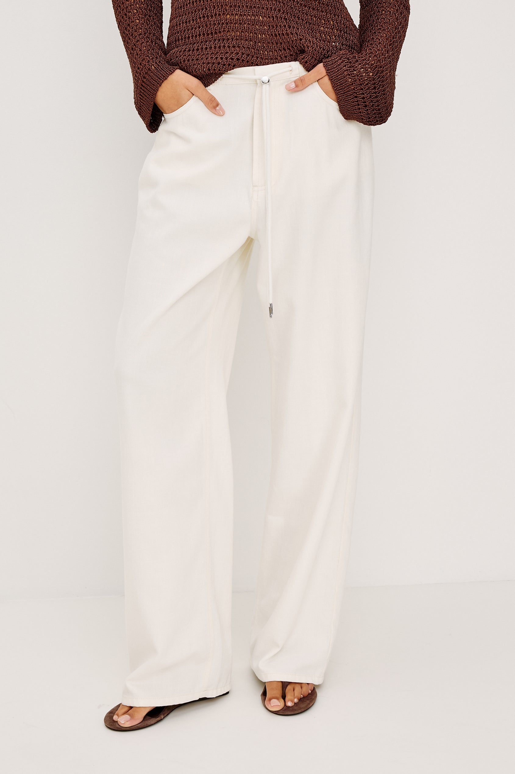 Normandie Relaxed Pant in Cotton Lyocell Denim With Adjustable Drawstring Toggles and 5-Pocket Styling in Ivory Colorway - Full Body Front View Featured on Model