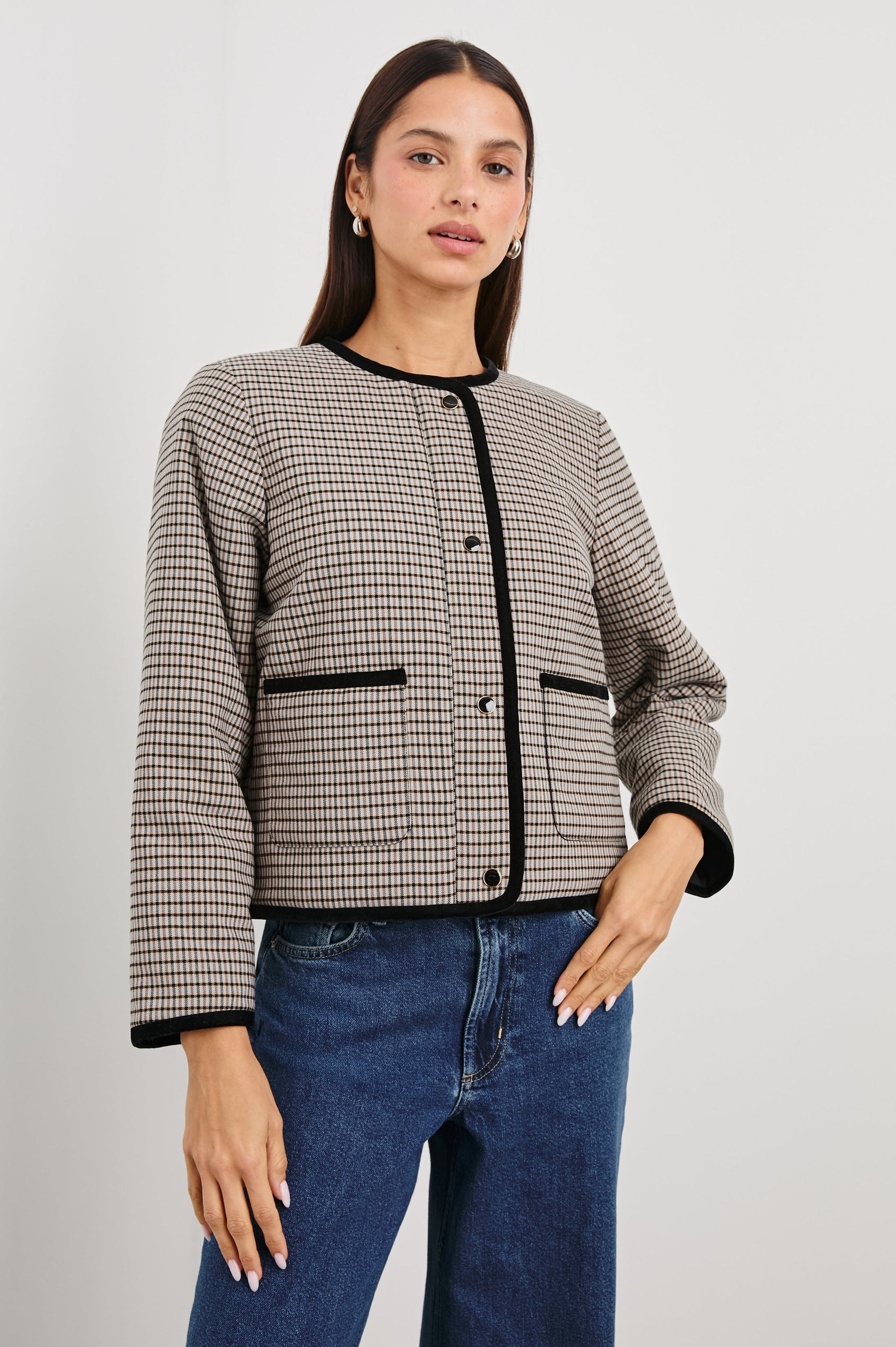 Nota Cropped Jacket with Snap and Zipper Closure and Two Front Patch Pockets in Ice Taupe Mini Check Colorway, a black and brown plaid with black trim - Front View Featured on Model