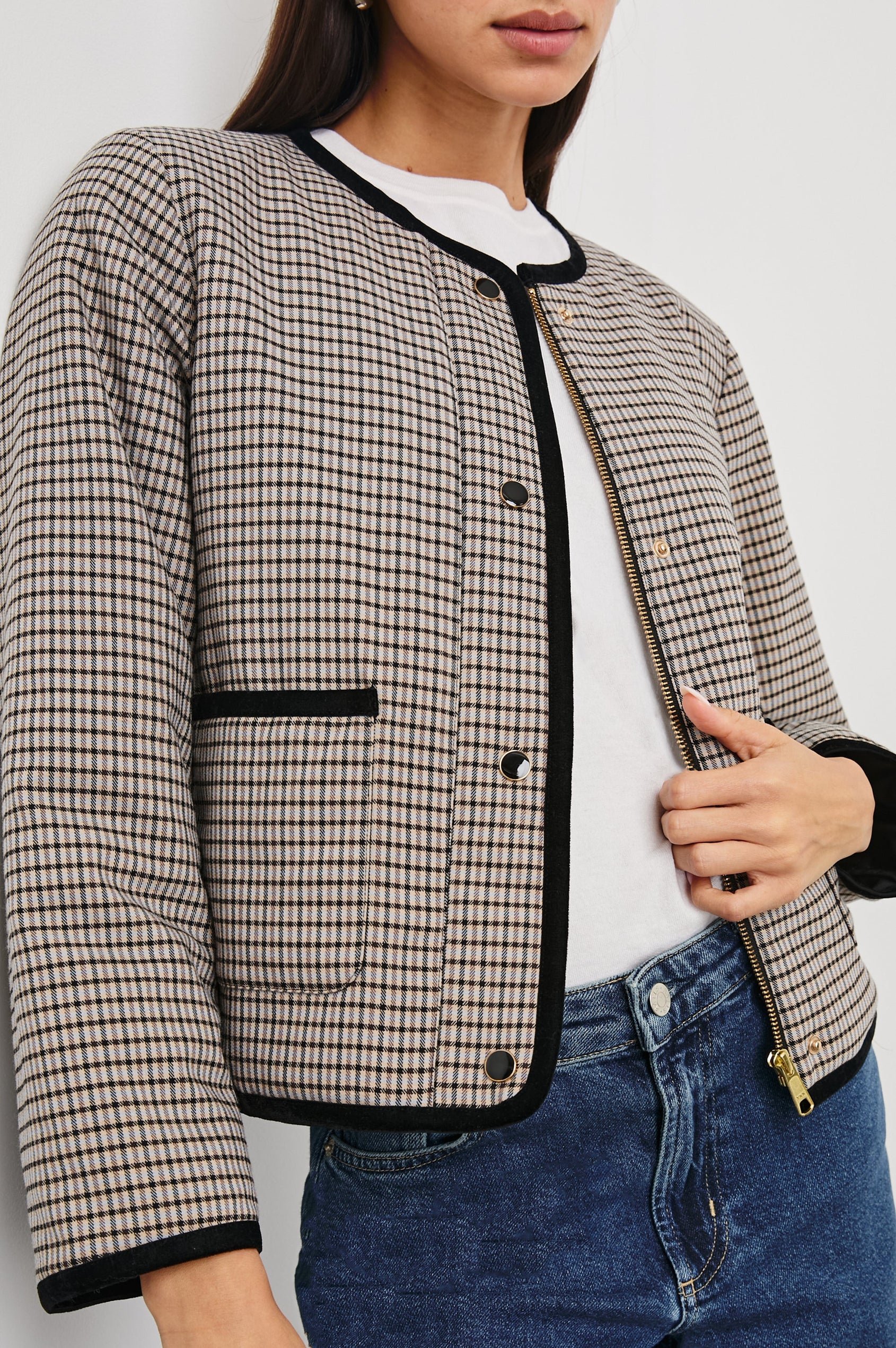 Nota Cropped Jacket with Snap and Zipper Closure and Two Front Patch Pockets in Ice Taupe Mini Check Colorway, a black and brown plaid with black trim - Front View Featured on Model