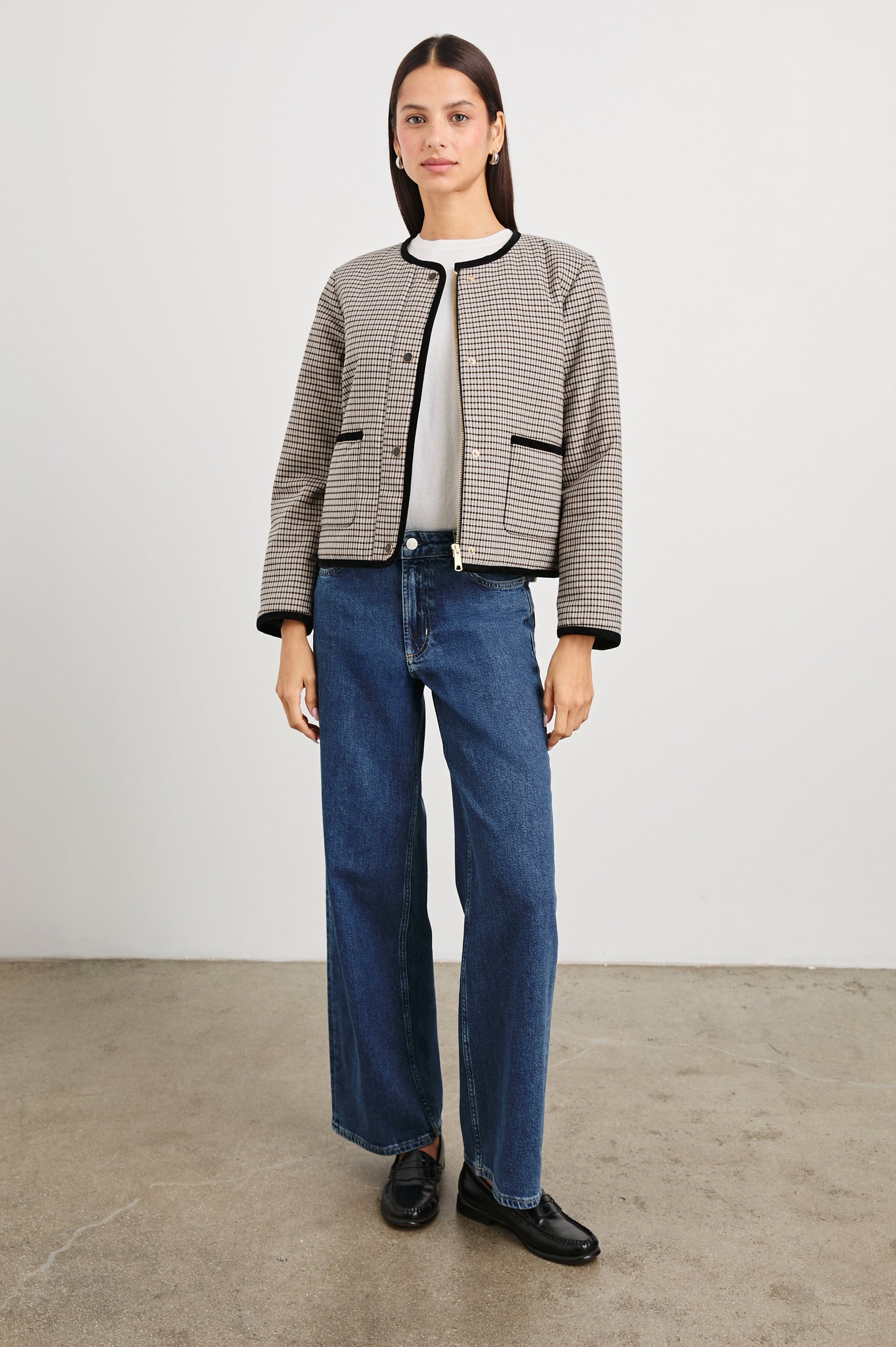 Nota Cropped Jacket with Snap and Zipper Closure and Two Front Patch Pockets in Ice Taupe Mini Check Colorway, a black and brown plaid with black trim - Front Full Body View Featured on Model