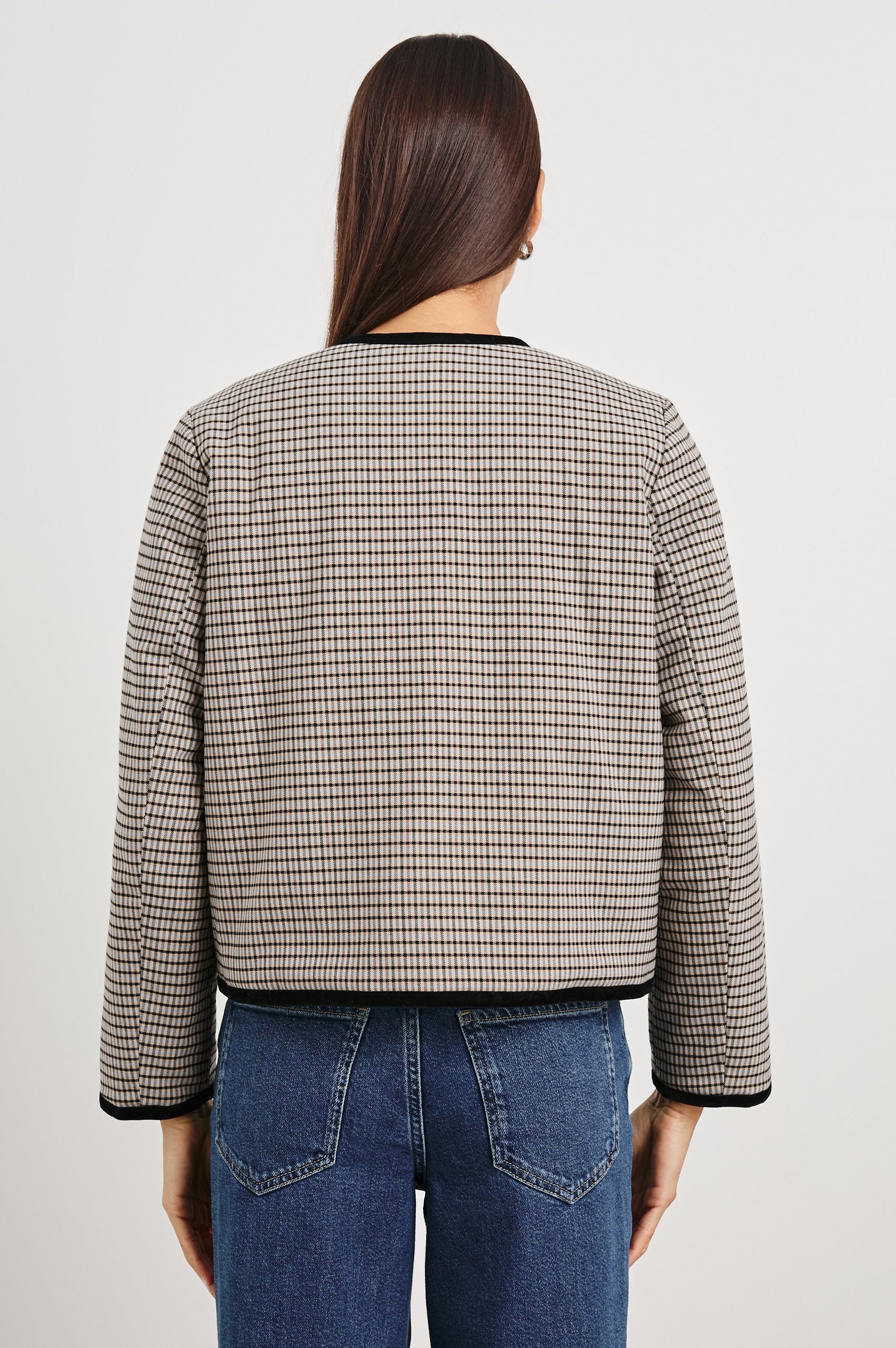 Nota Cropped Jacket with Snap and Zipper Closure and Two Front Patch Pockets in Ice Taupe Mini Check Colorway, a black and brown plaid with black trim - Back View Featured on Model