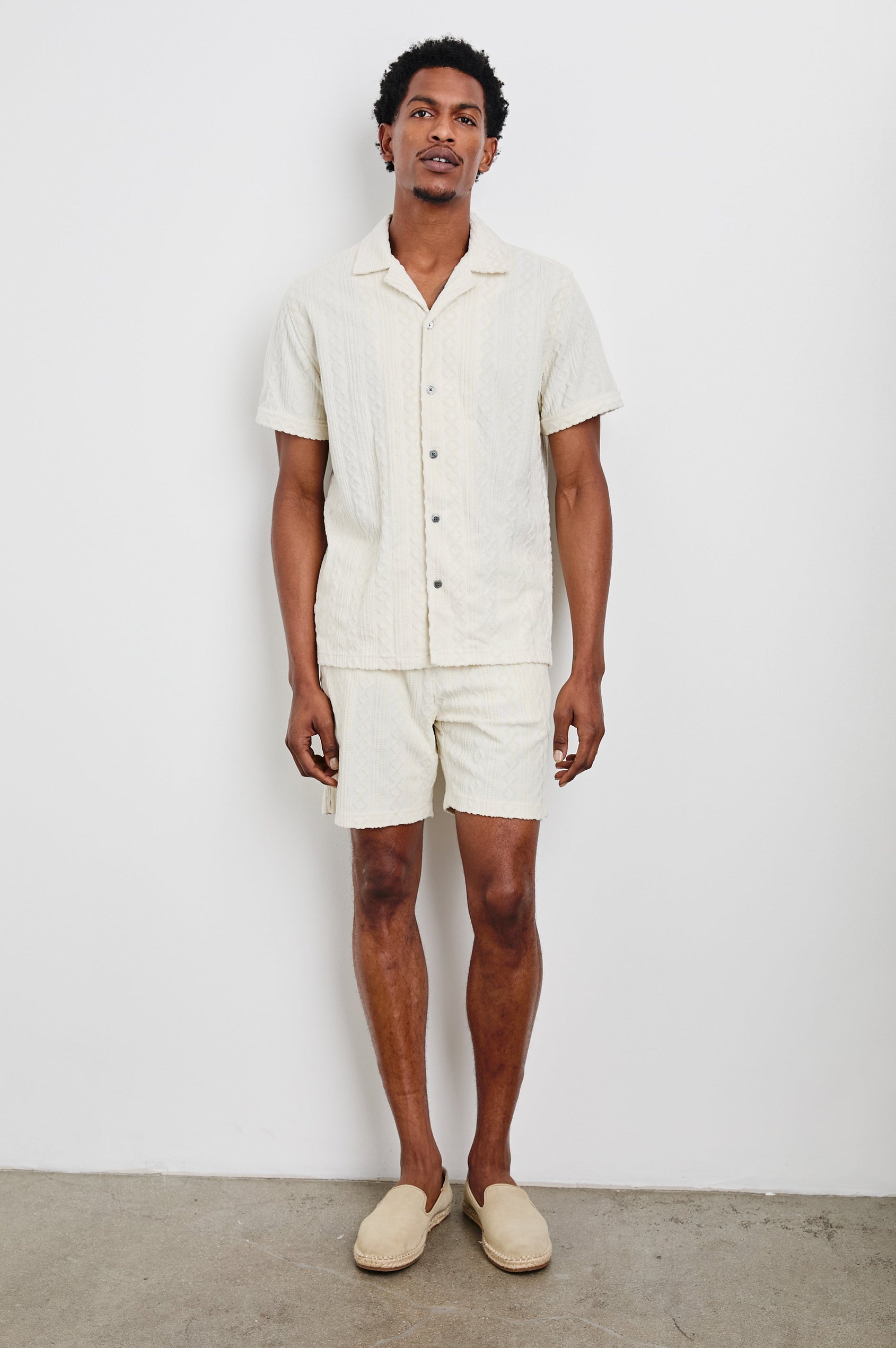 Nova Shorts with a Drawstring Waist, a Raised Jacquard Pattern, Two Front Pockets and a Back Patch Pocket in Ecru Colorway - Front Full Body View Featured on Model