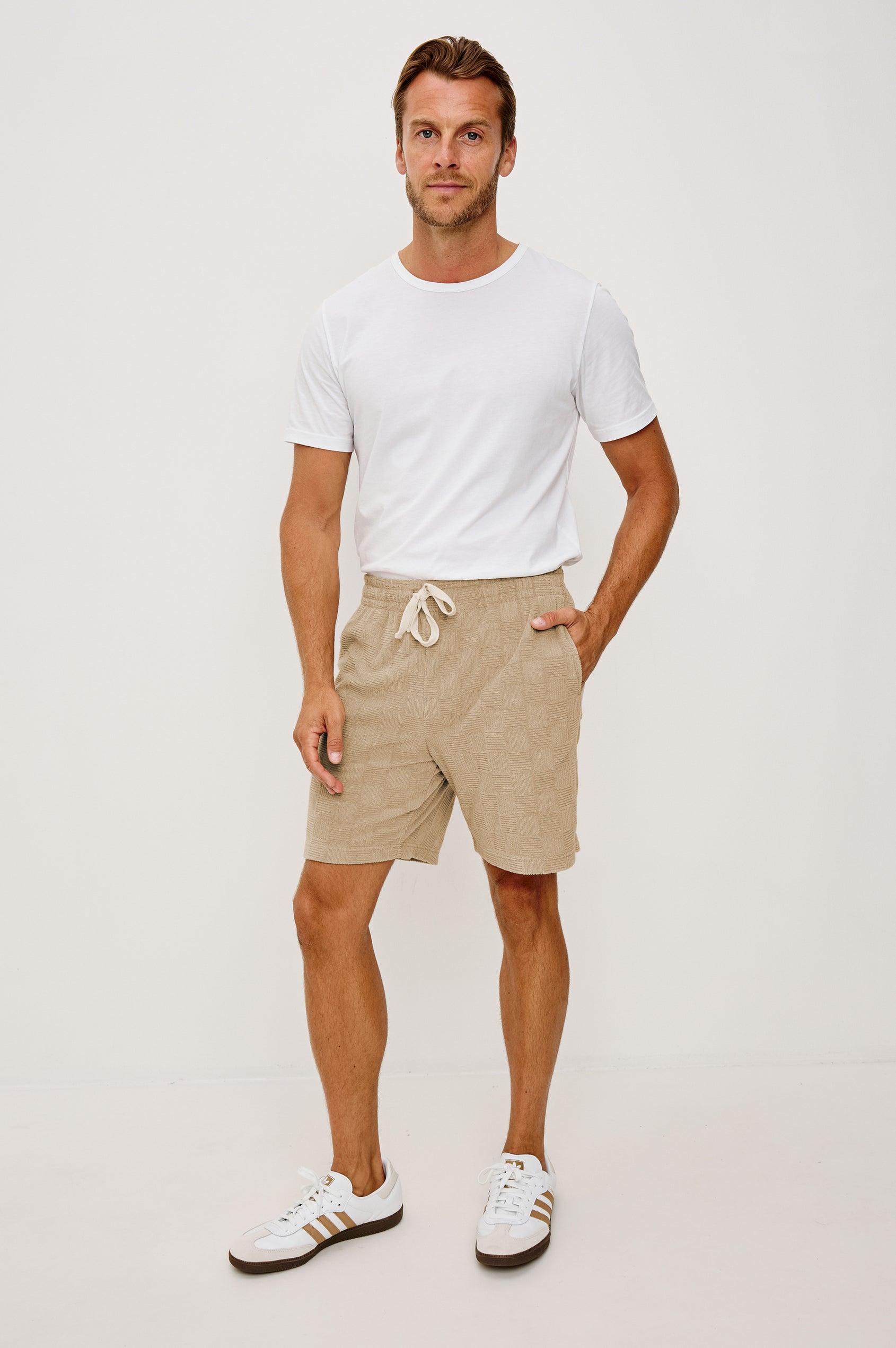 Nova Short in French Terry With Raised Jacquard Pattern, Side Pockets, and Drawstring Waist Ties in Grange Craft Paper Colorway - Full Body Front View Featured on Model