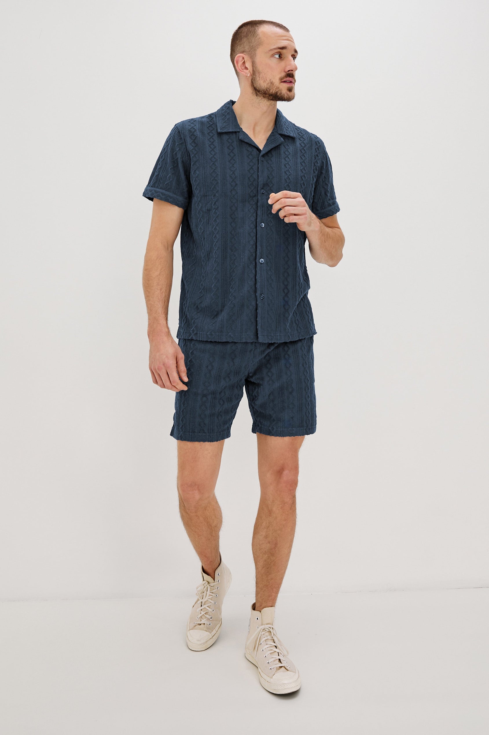 Nova Shorts with a Drawstring Waist, a Raised Jacquard Pattern, Two Front Pockets and a Back Patch Pocket in Ecru Colorway - Full Body Front View Featured on Model