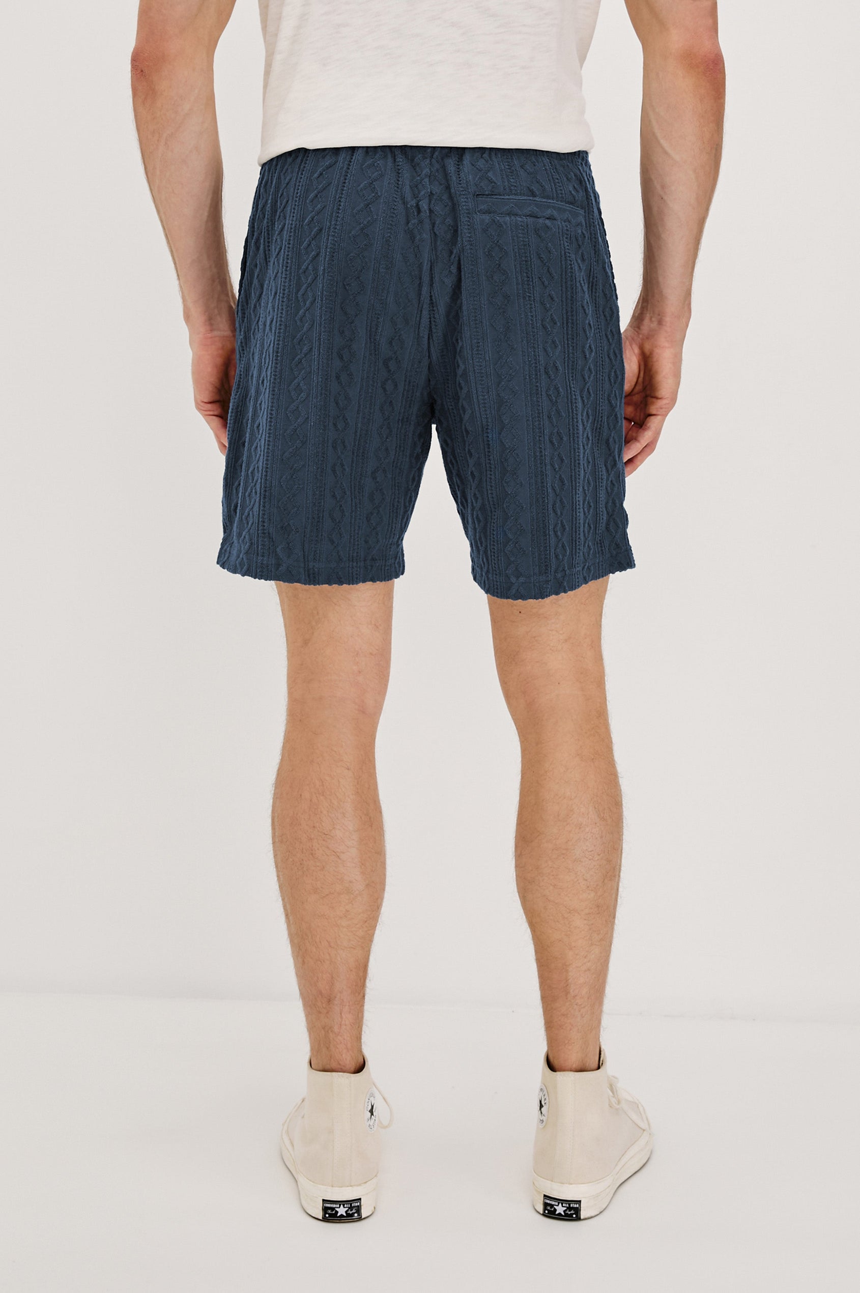 Nova Shorts with a Drawstring Waist, a Raised Jacquard Pattern, Two Front Pockets and a Back Patch Pocket in Ecru Colorway - Back View Featured on Model