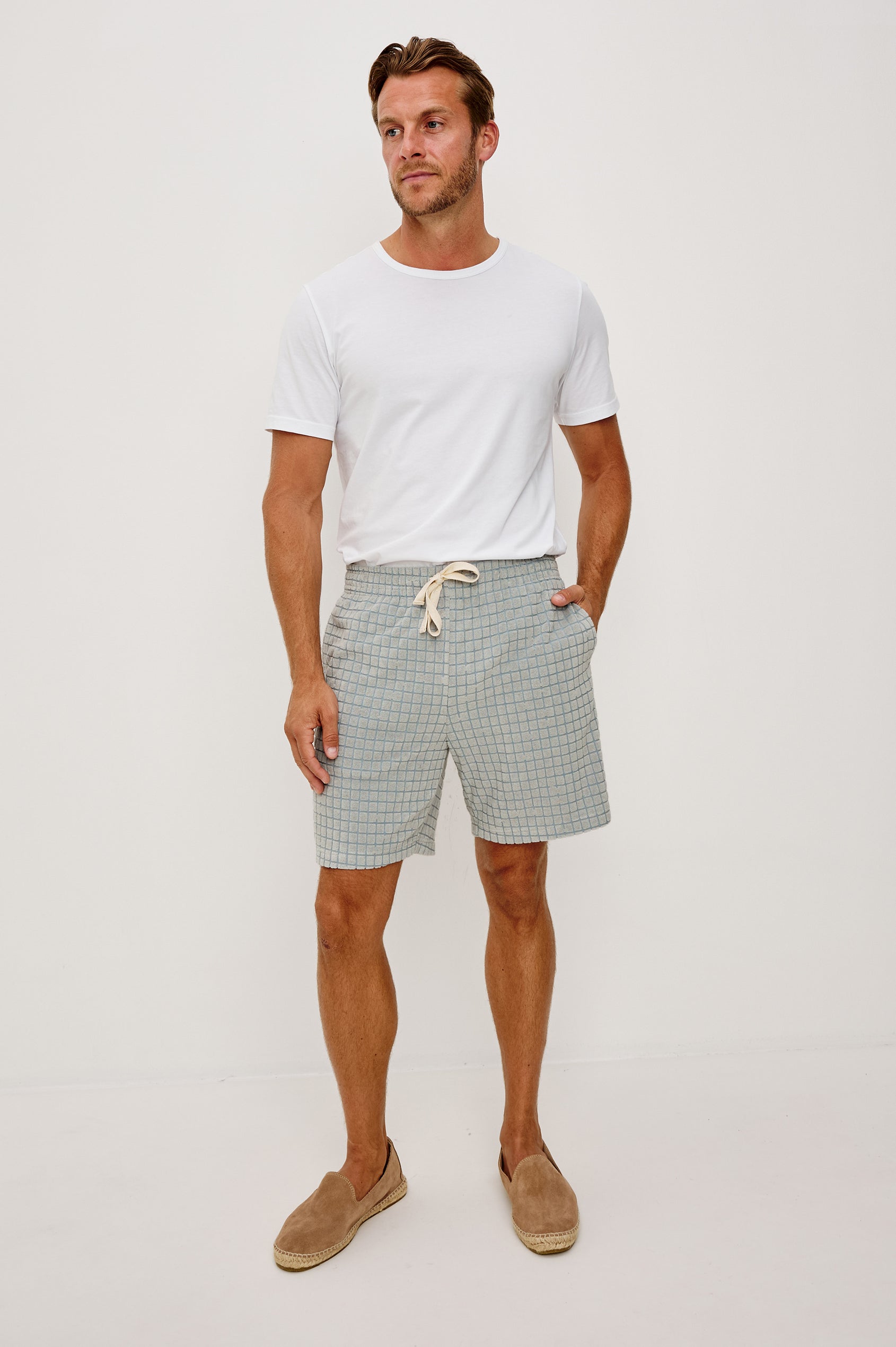 Nova Short in French Terry With Raised Jacquard Pattern, Side Pockets, and Drawstring Waist Ties in Silver Line Grid Colorway - Full Body Front View Featured on Model