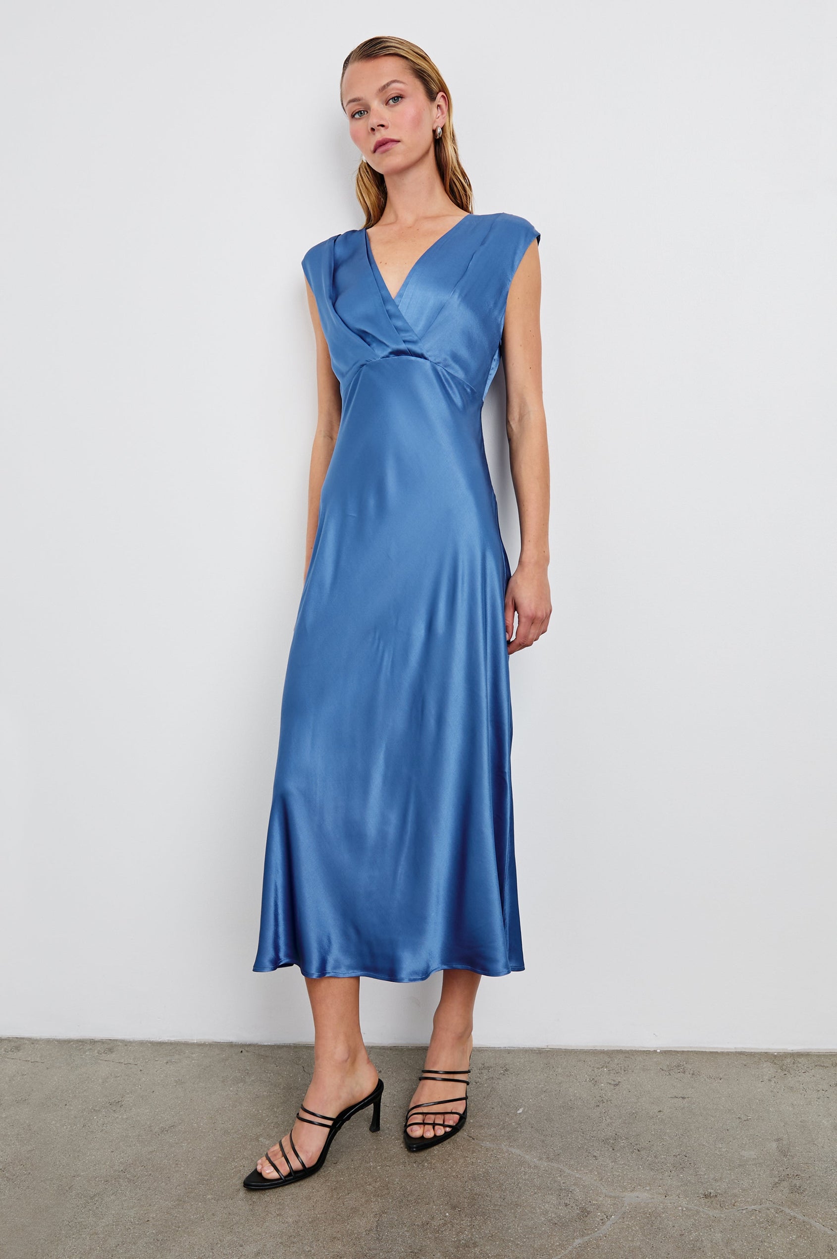 Odella Midi Dress with Cap Sleeves, Double Front Crossover Bodice, Deep V Neck and a Back Neck Tie in Atlantic Colorway - Front Full Body View Featured on Model 