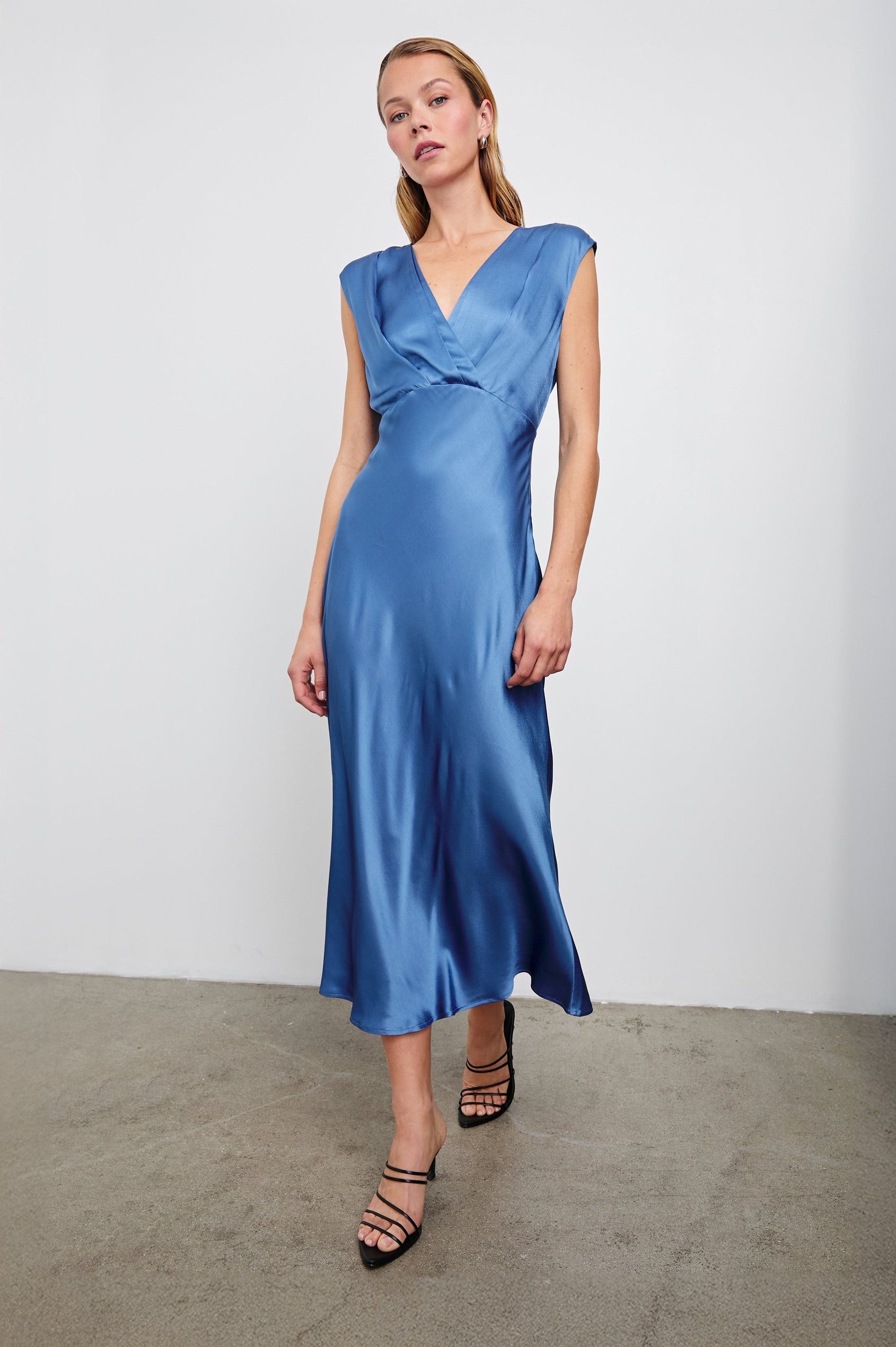 Odella Midi Dress with Cap Sleeves, Double Front Crossover Bodice, Deep V Neck and a Back Neck Tie in Atlantic Colorway - Front Full Body View Featured on Model 