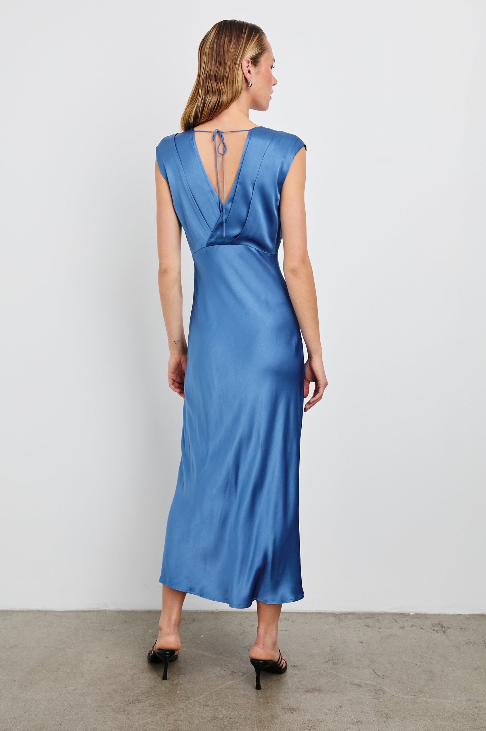 Odella Midi Dress with Cap Sleeves, Double Front Crossover Bodice, Deep V Neck and a Back Neck Tie in Atlantic Colorway - Back Full Body View Featured on Model 