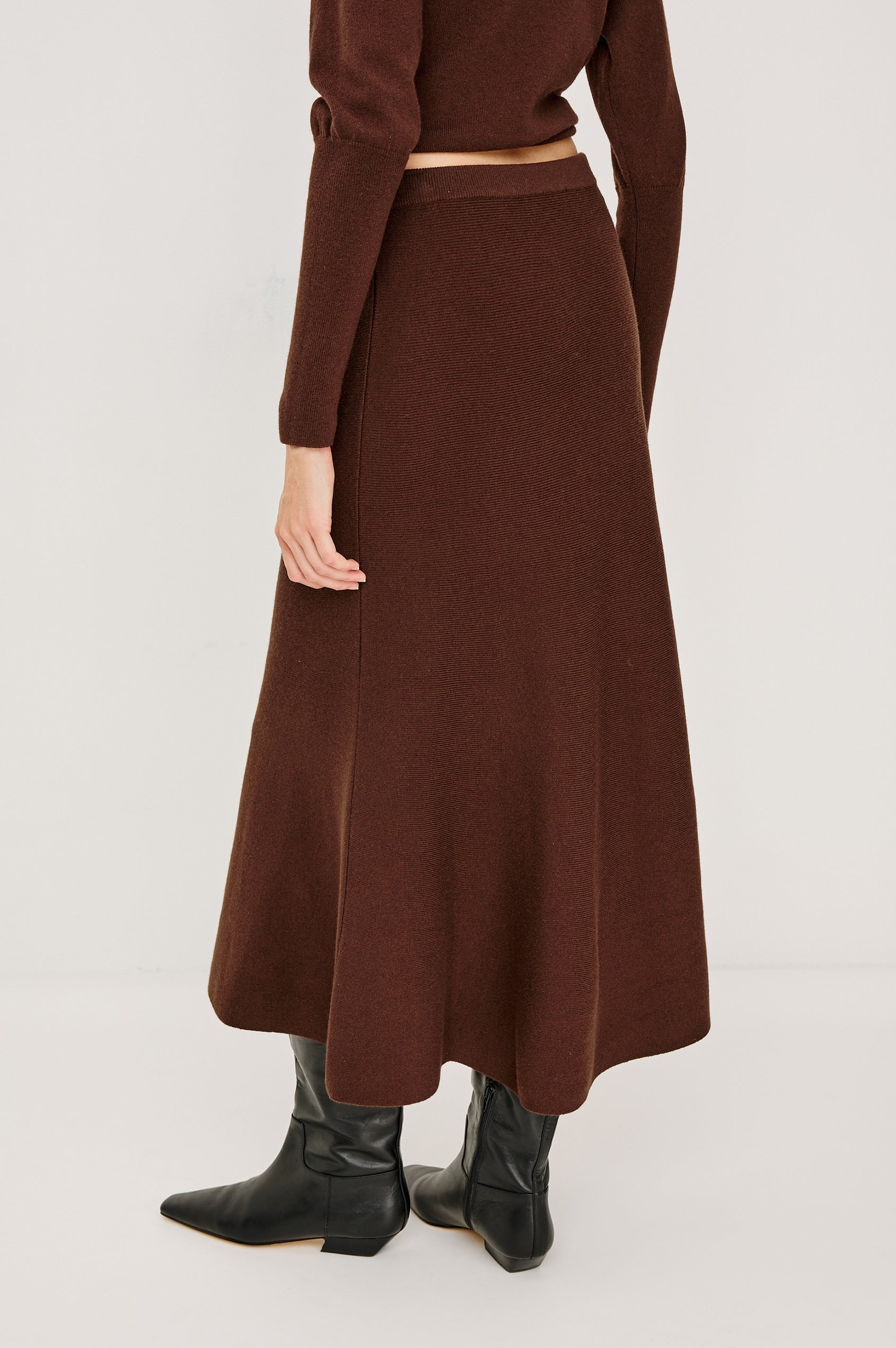 Odita High-Waisted A-lIne Midi Skirt in Wool Blend in Bordeaux Colorway - Lower Body Back View Featured on Model
