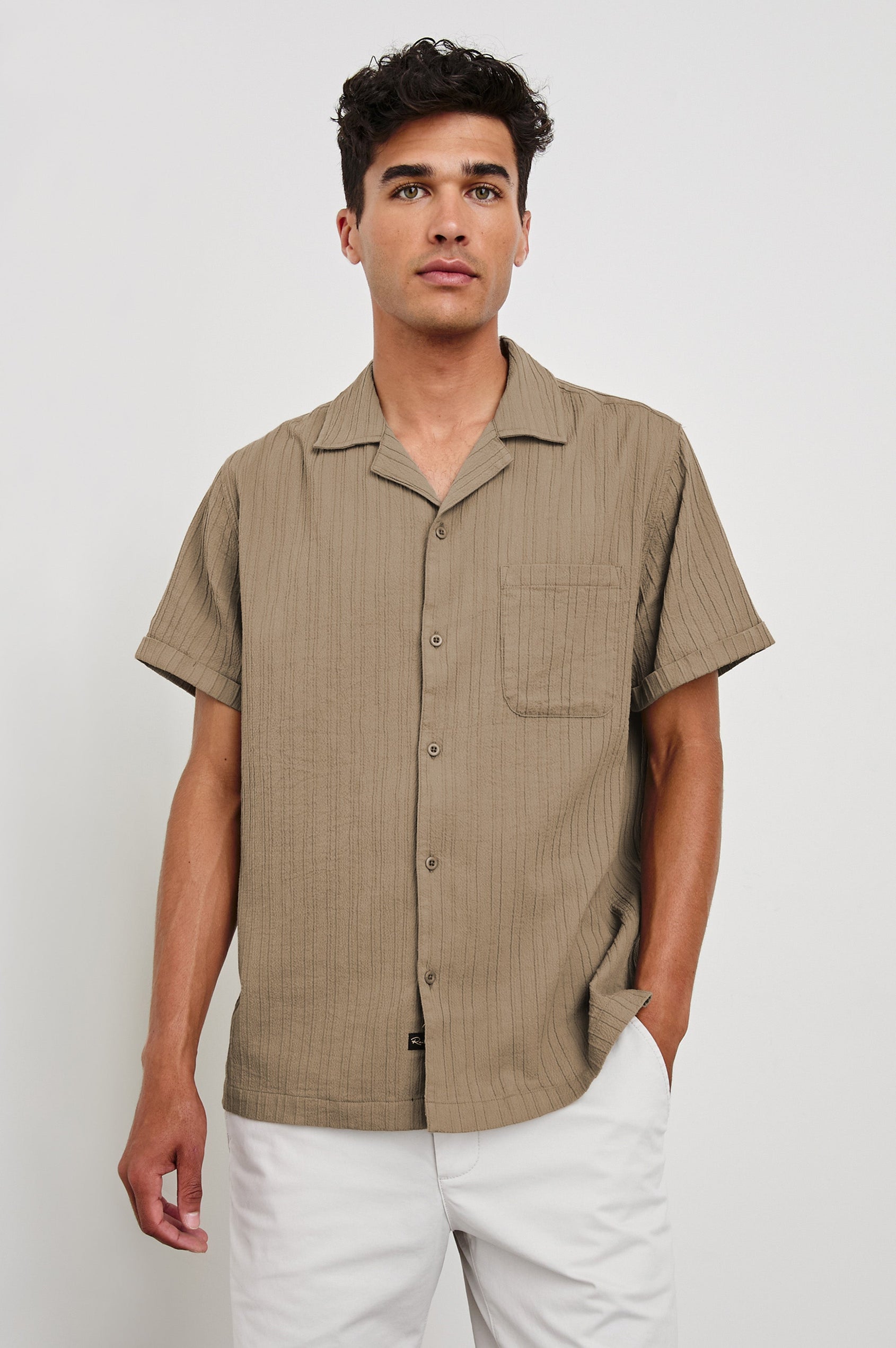 Ohana textured button up short sleeve shirt with collar and front chest pocket in Olive - front view on model, hand in pocket